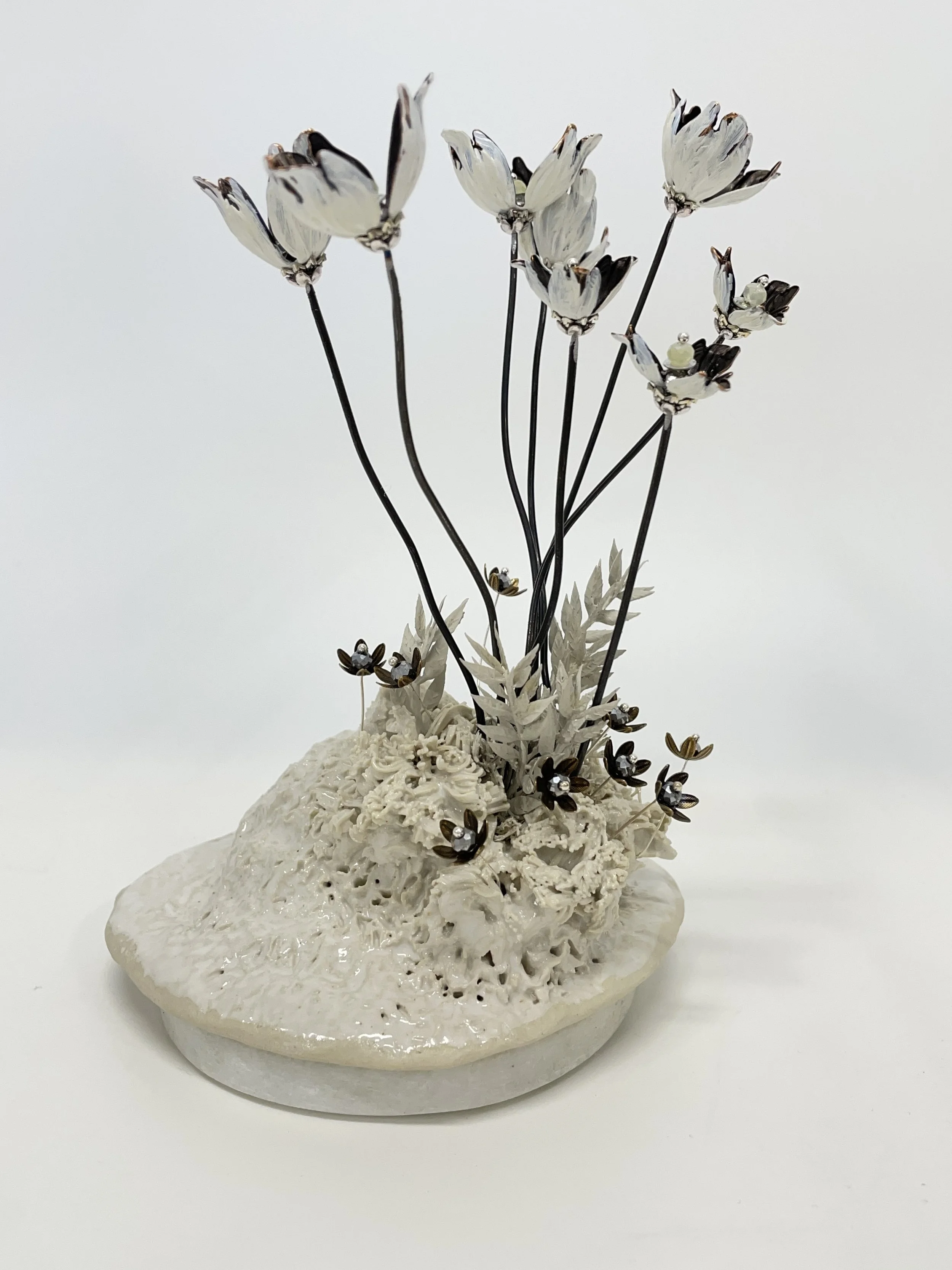 Glazed stoneware, artificial leaves, acrylic paint, metal bead-caps, steel, sequins and beads on marble.