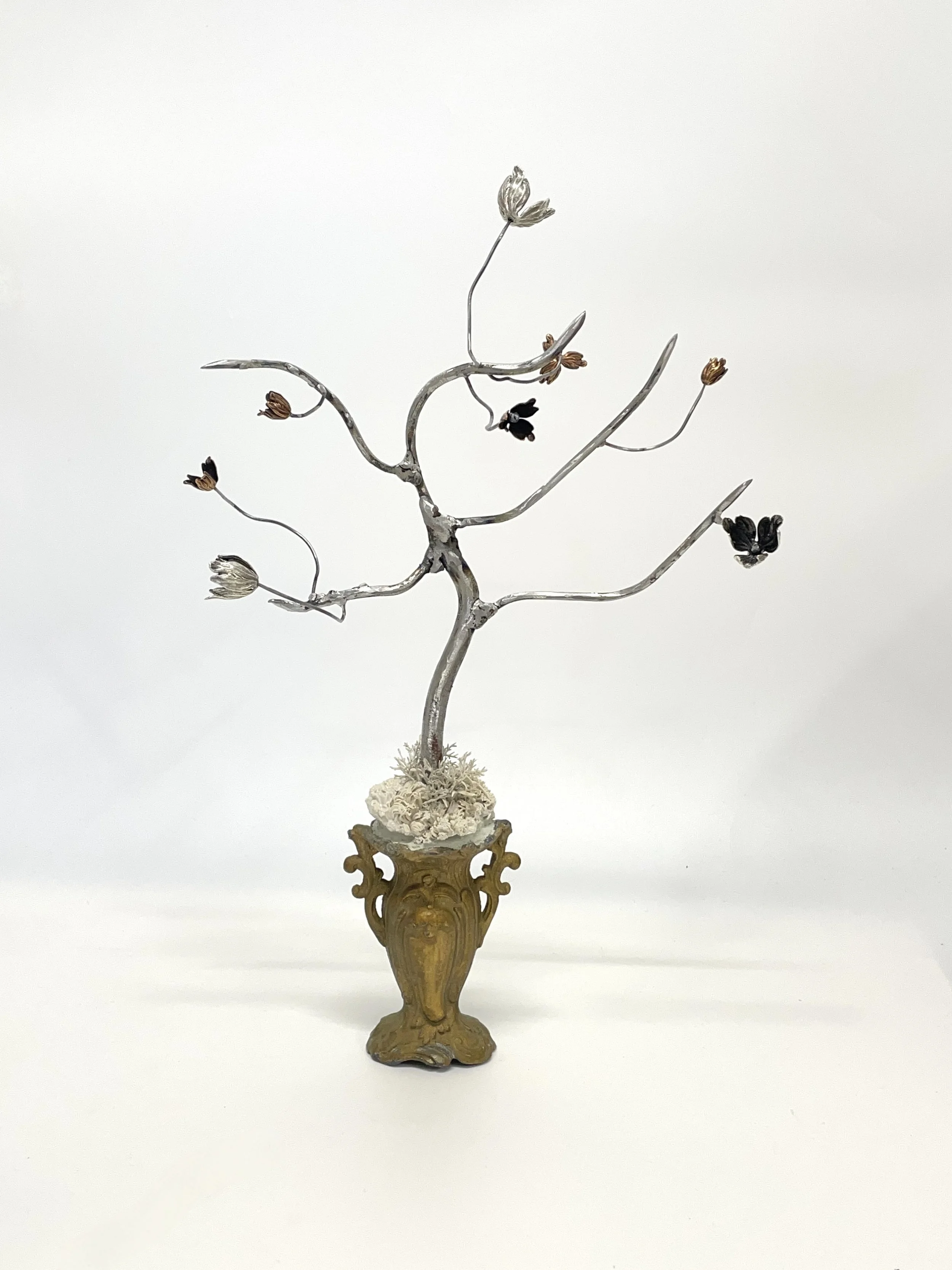 Glazed stoneware, artificial leaves, acrylic paint, metal bead-caps, welded steel and bead-caps on readymade/found vintage base.