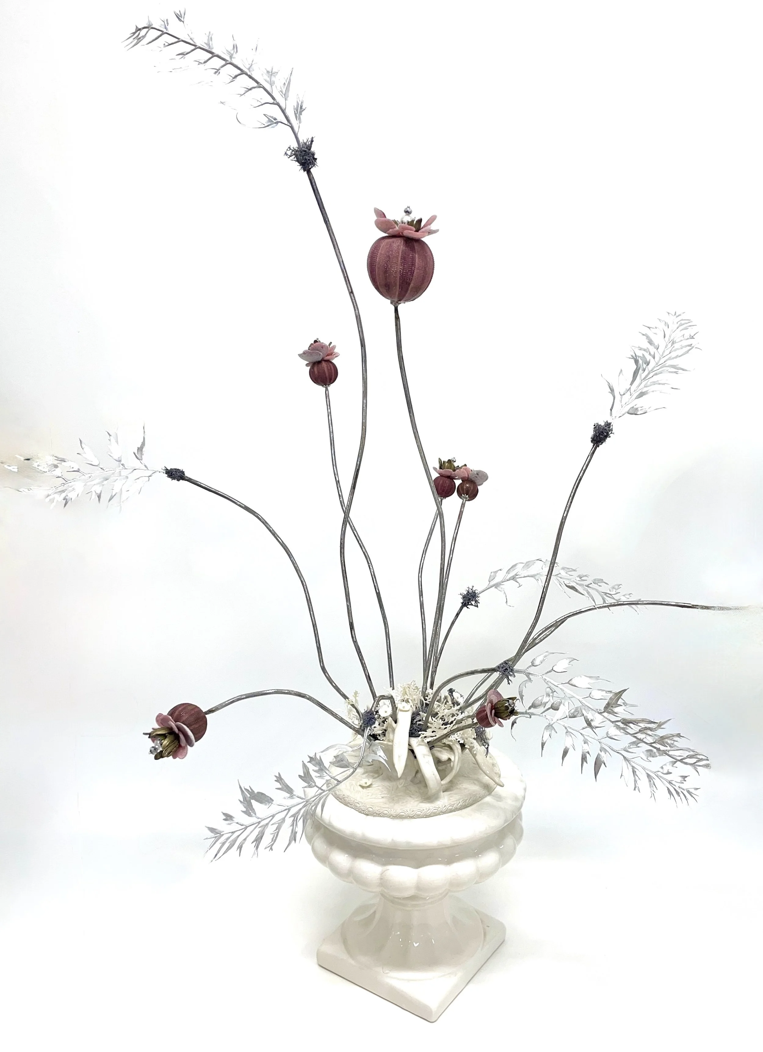 'Joie de Vivre' Sculpted steel, glazed stoneware, mother-of-pearl ready-made flowers, beads, artificial foliage, sea urchins and cement in vintage ceramic urn. H 82cm x W 64cm x D 45cm. 2026