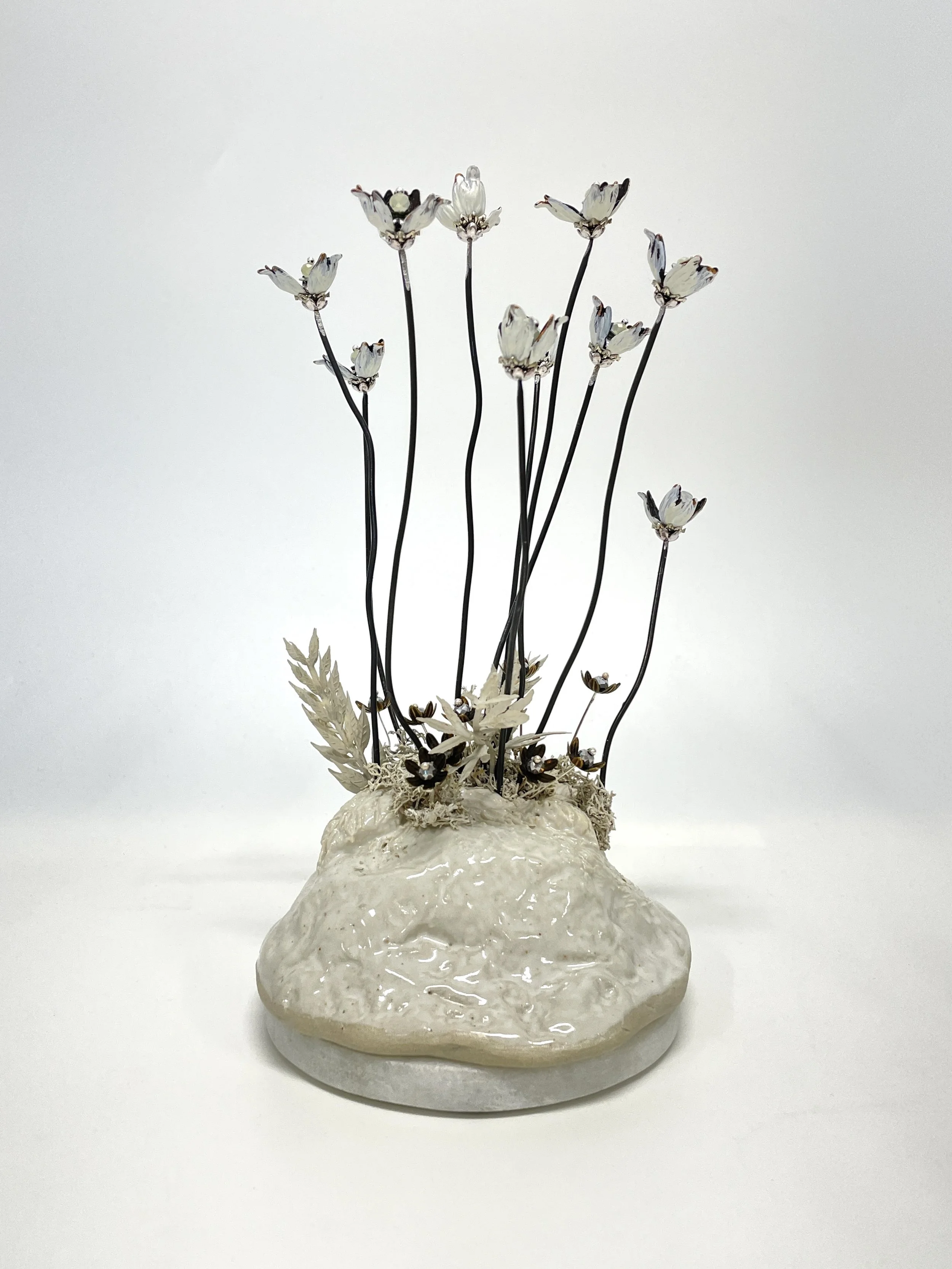 Glazed stoneware, artificial leaves, acrylic paint, metal bead-caps, steel, sequins and beads on marble.