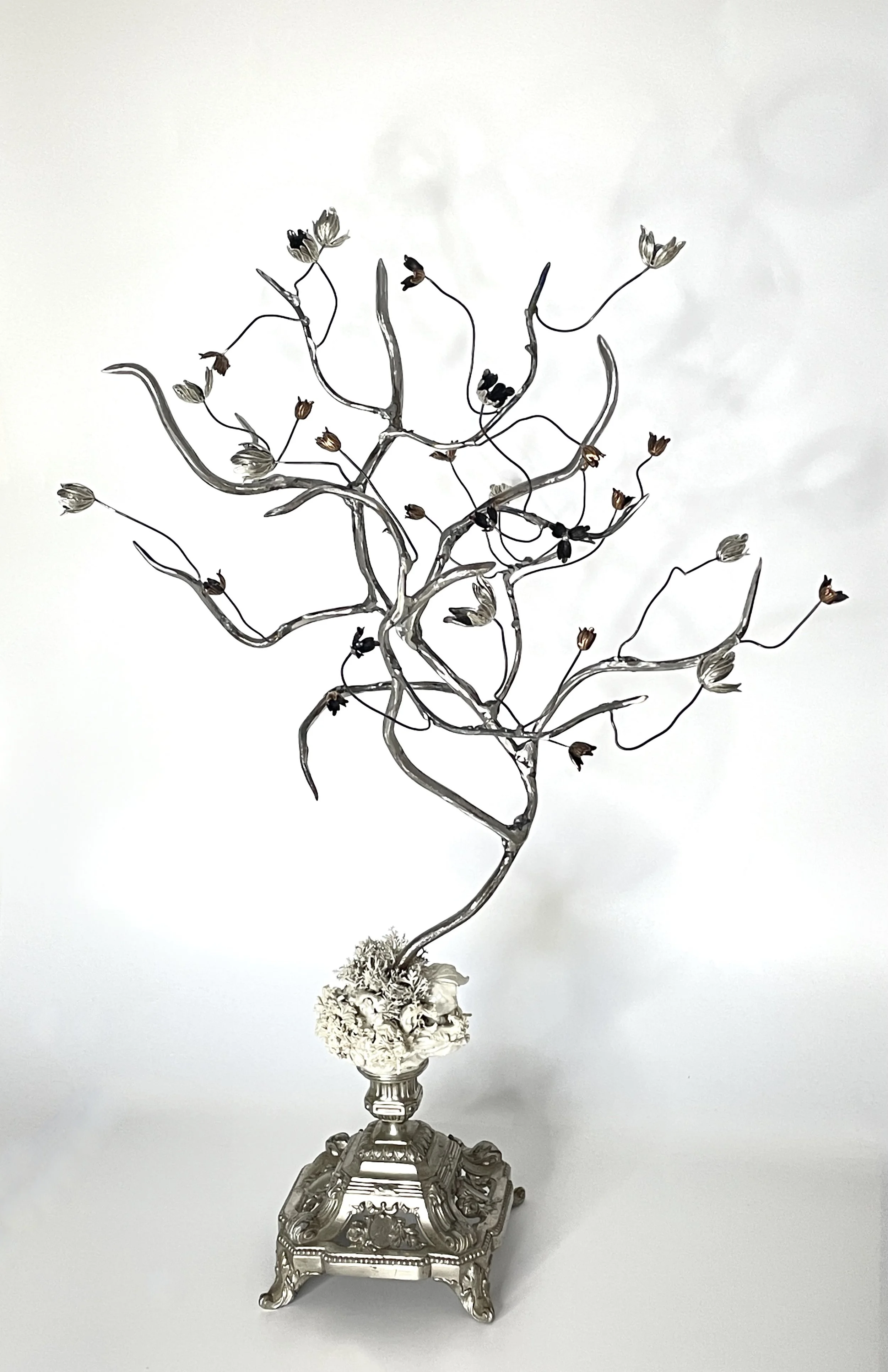 Glazed stoneware, artificial leaves, acrylic paint, metal bead-caps, welded steel and bead-caps on readymade/found vintage base.