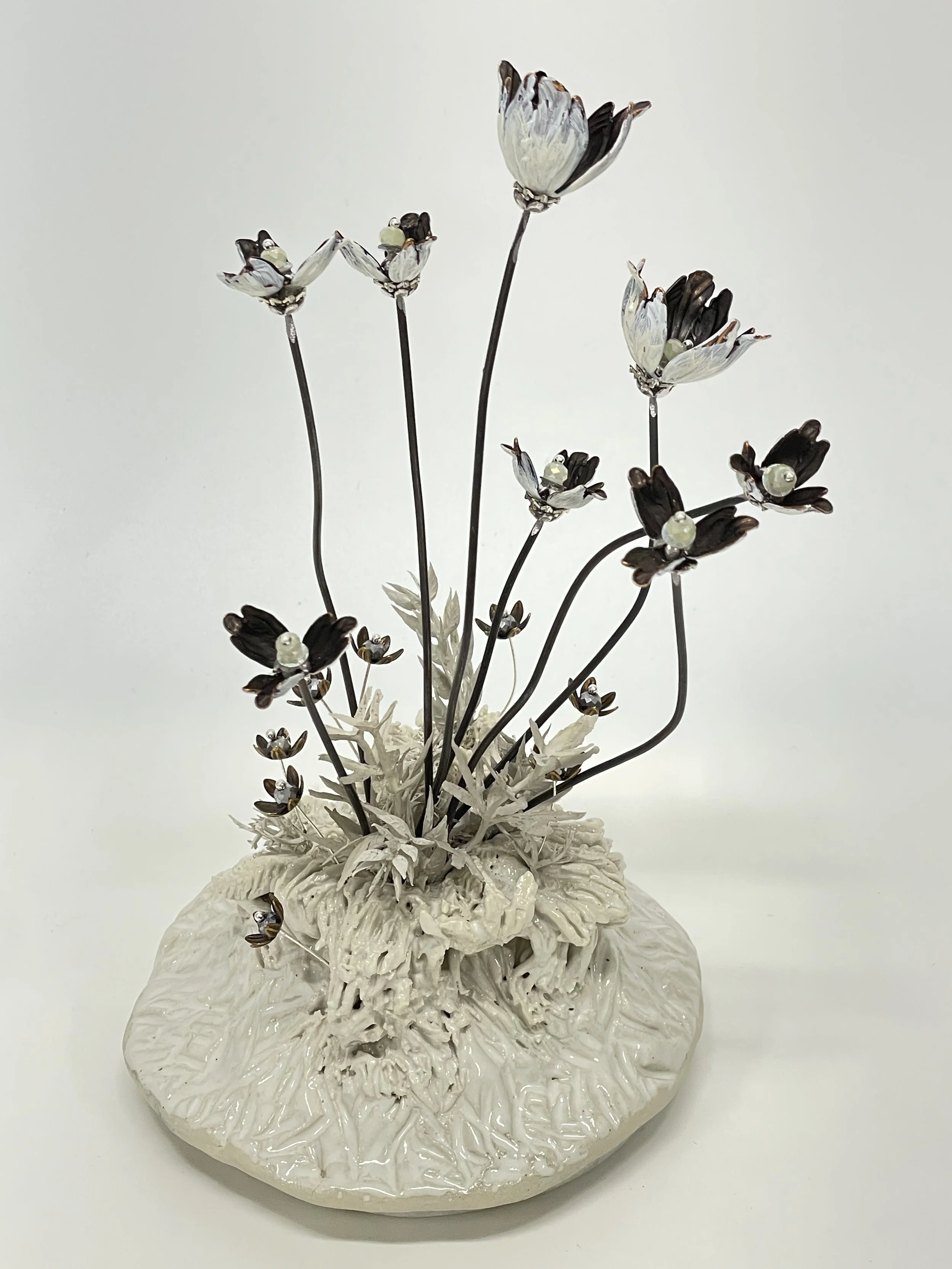 Glazed stoneware, artificial leaves, acrylic paint, metal bead-caps, steel, sequins and beads on marble.