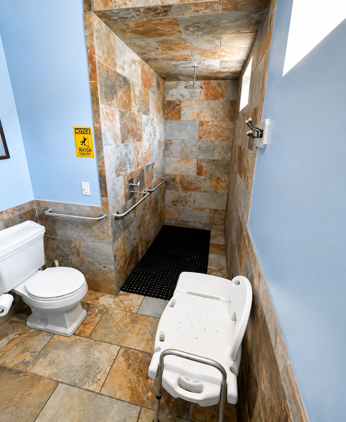 Accessible campground bathroom with tiled walk-in shower at Camp Creekside.