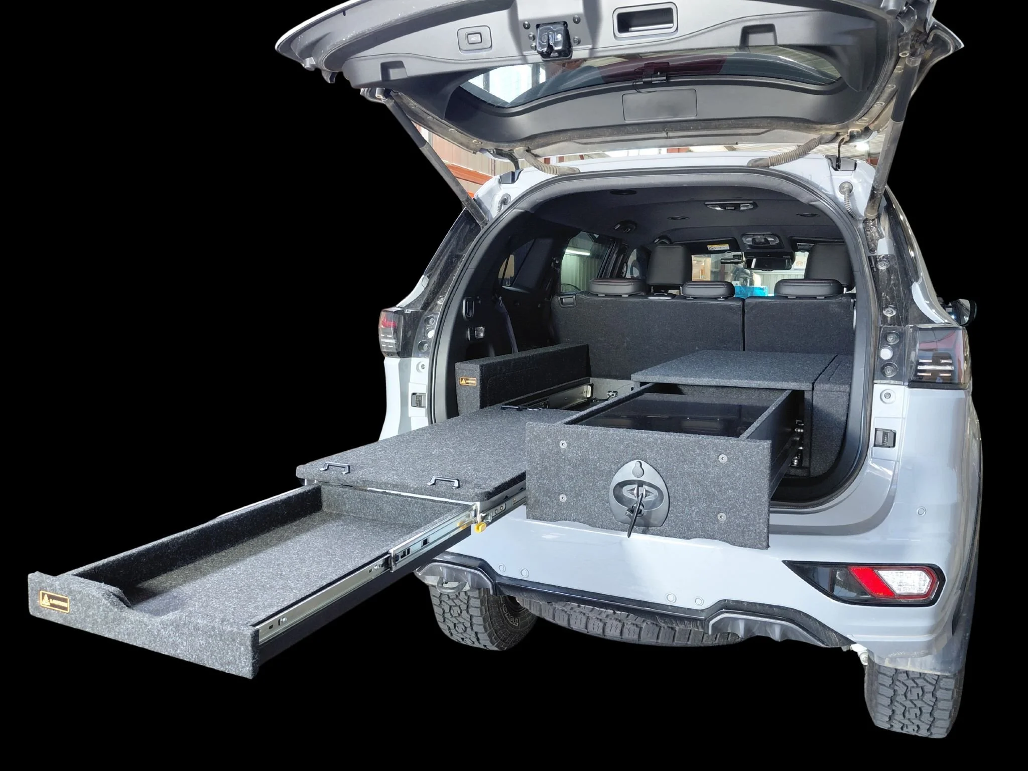 Isuzu MU-X Infinity floor showing modular drawer and fridge slide compatibility