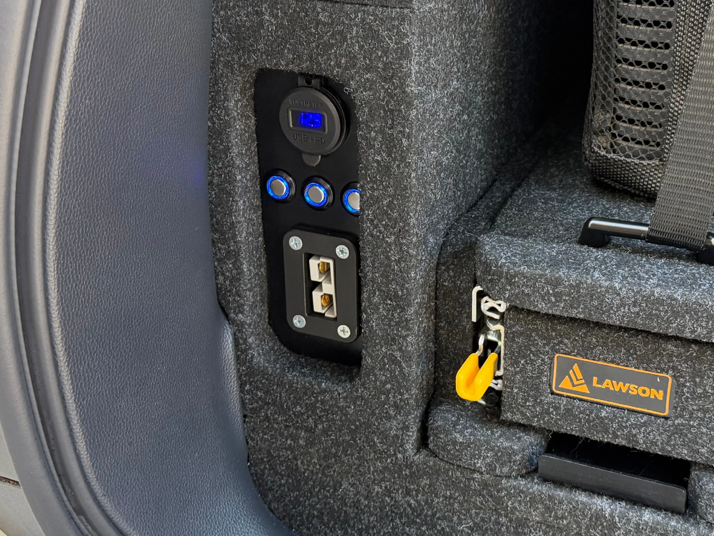 Prado 250 powered side wing close-up with Anderson outlet USB ports battery gauge and illuminated switches on Lawson Automotive INFINITY false floor system