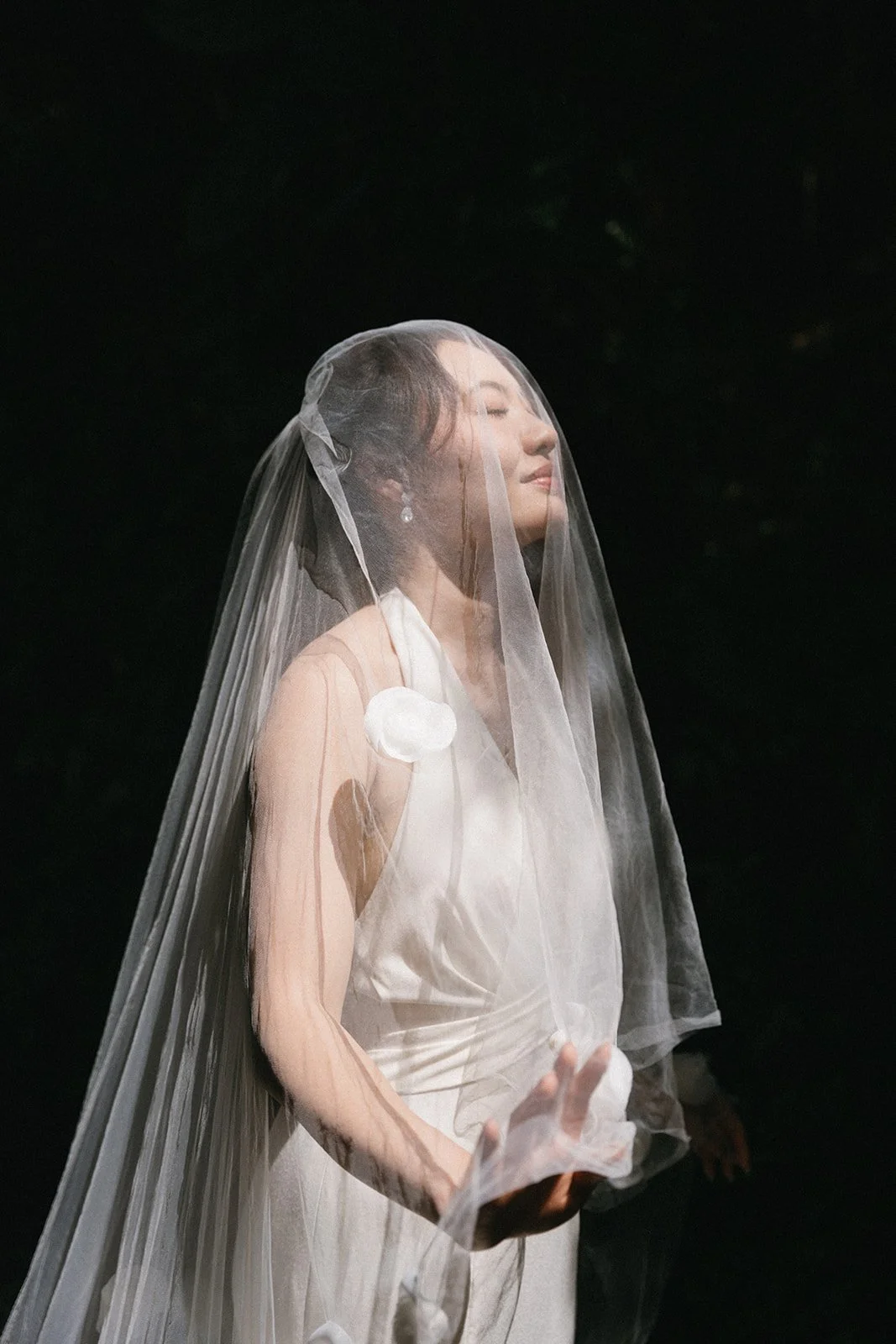 bride standing with elegant veil before wedding ceremony at sri panwa