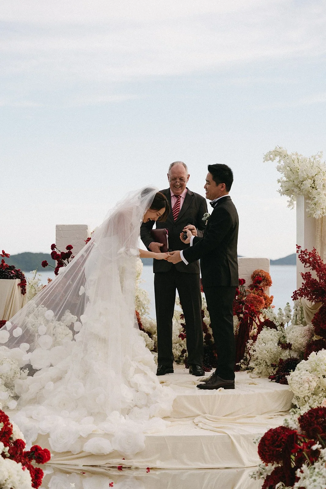 exchanging vows with ocean backdrop at sri panwa in phuket