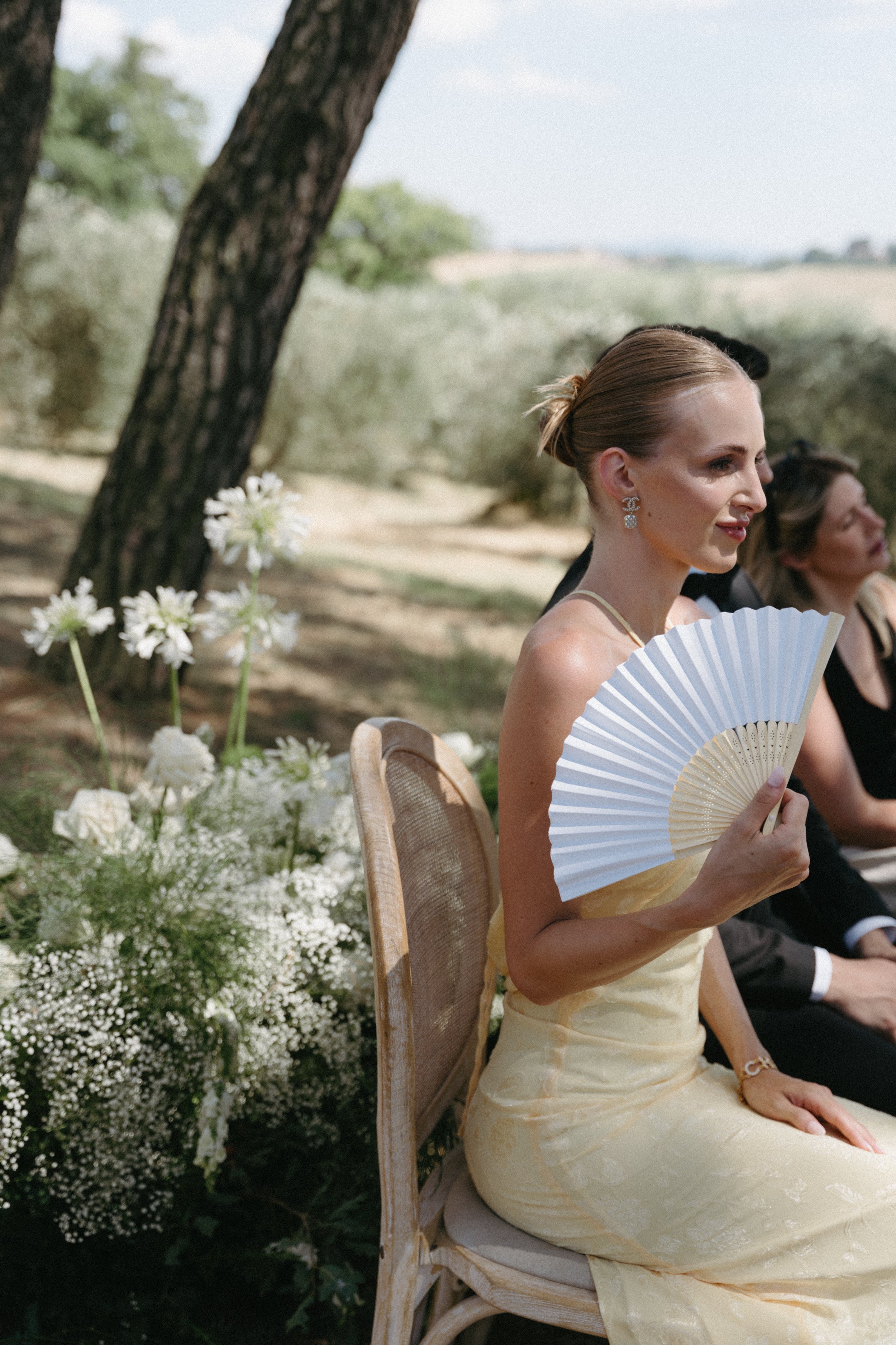 guests sitting during italian wedding ceremony at villa cozzano