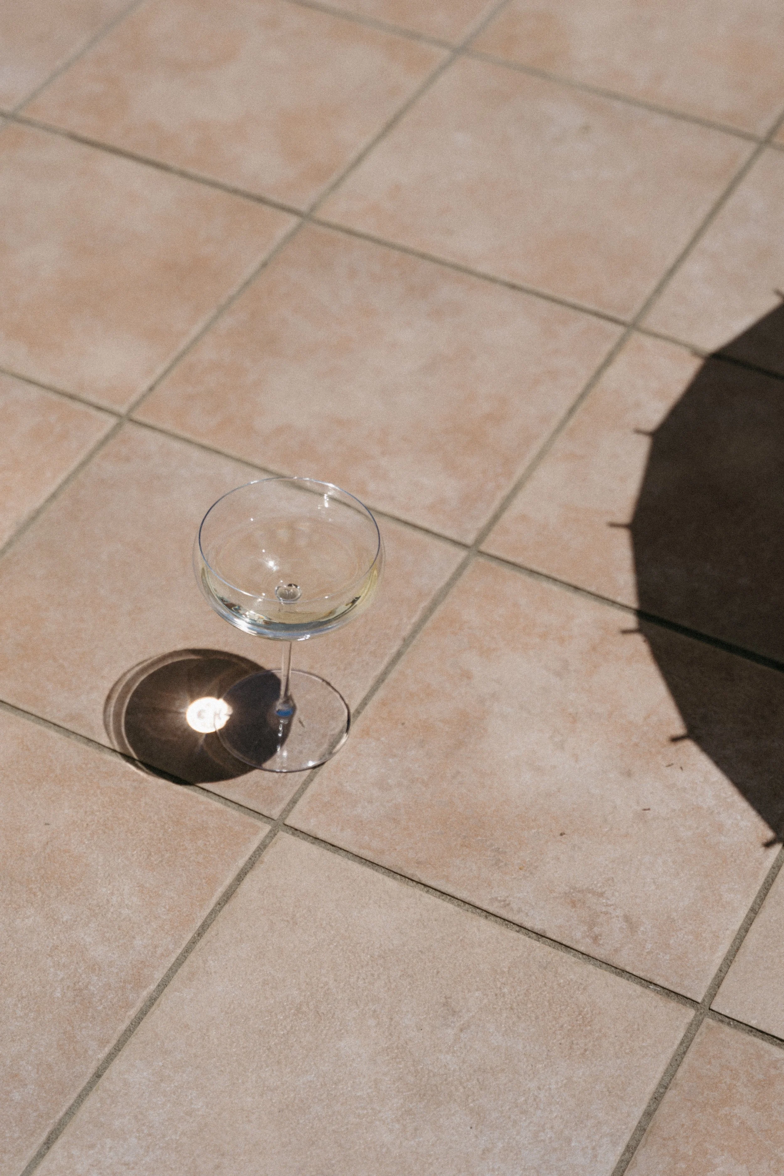 shot of champagne glass on tiles