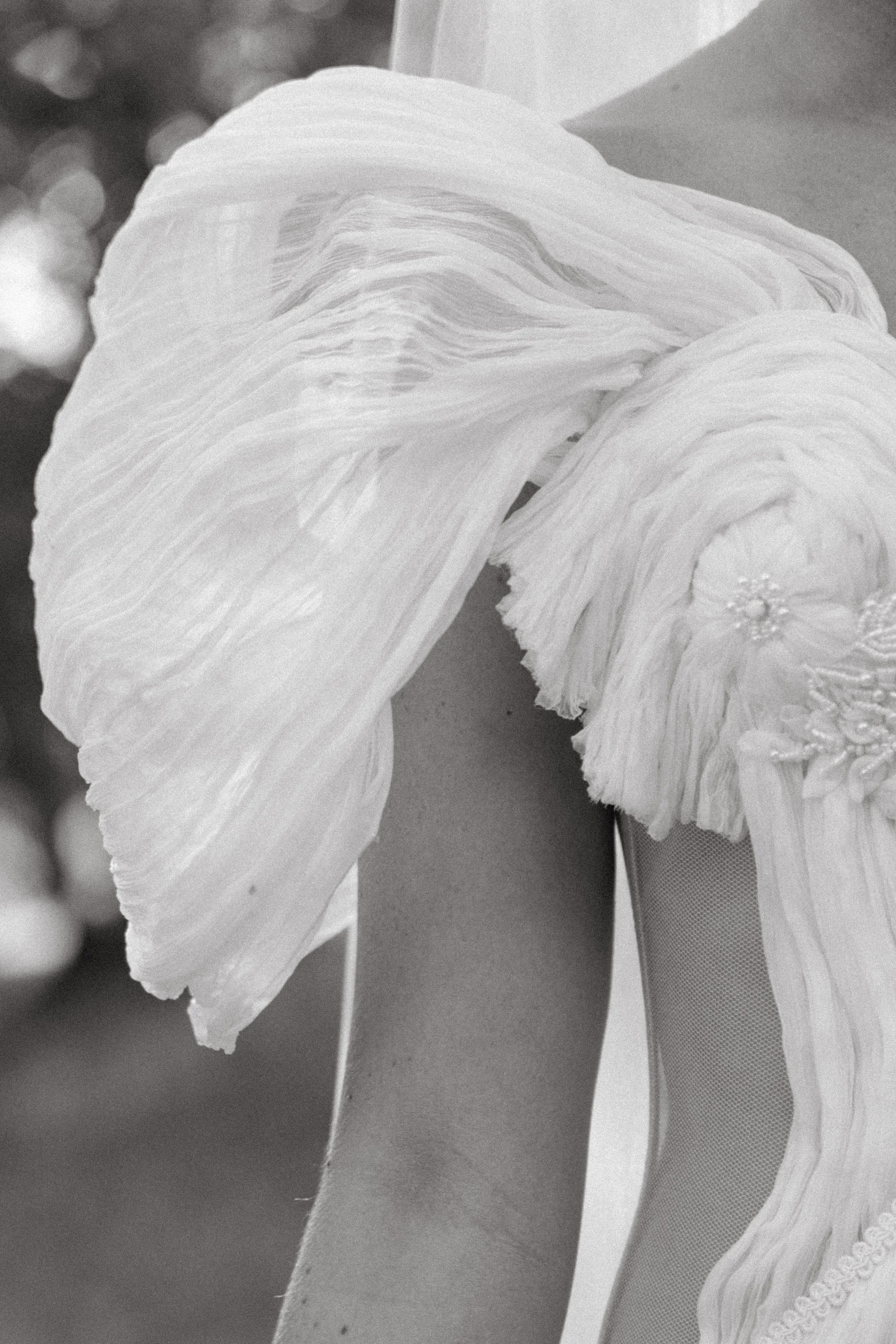 close up of brides dress sleeve during editorial shoot