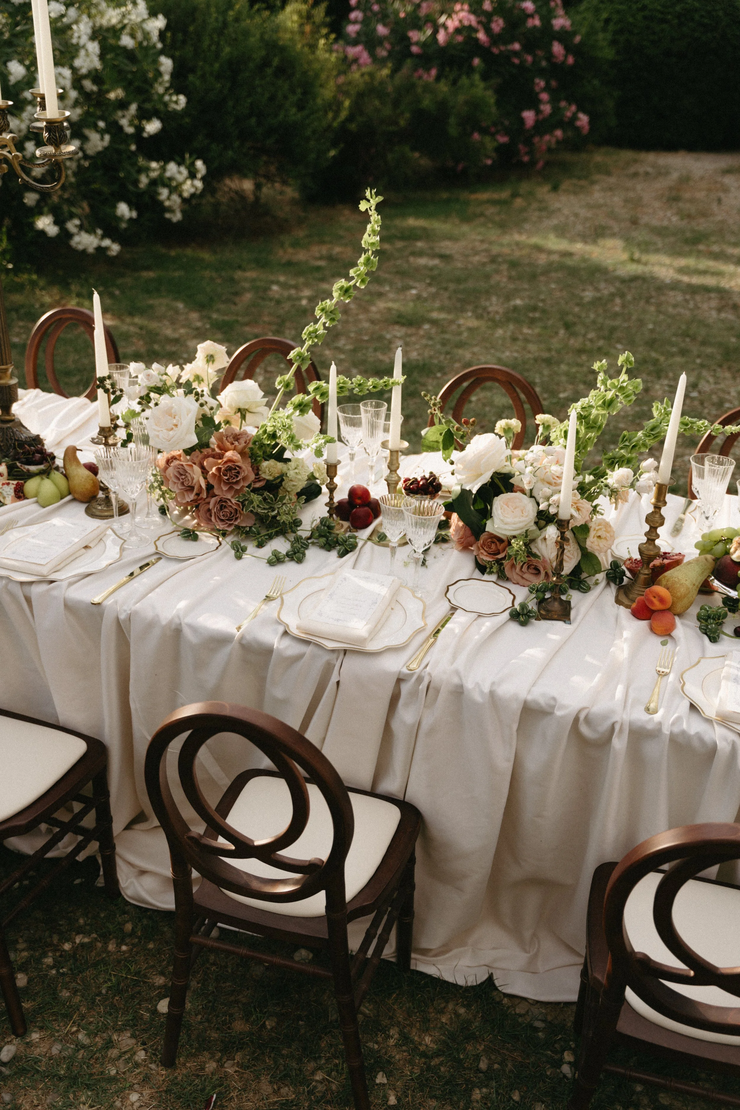 Intimate destination wedding dining area decorated with fresh flowers and soft linens at Villa Cozzano