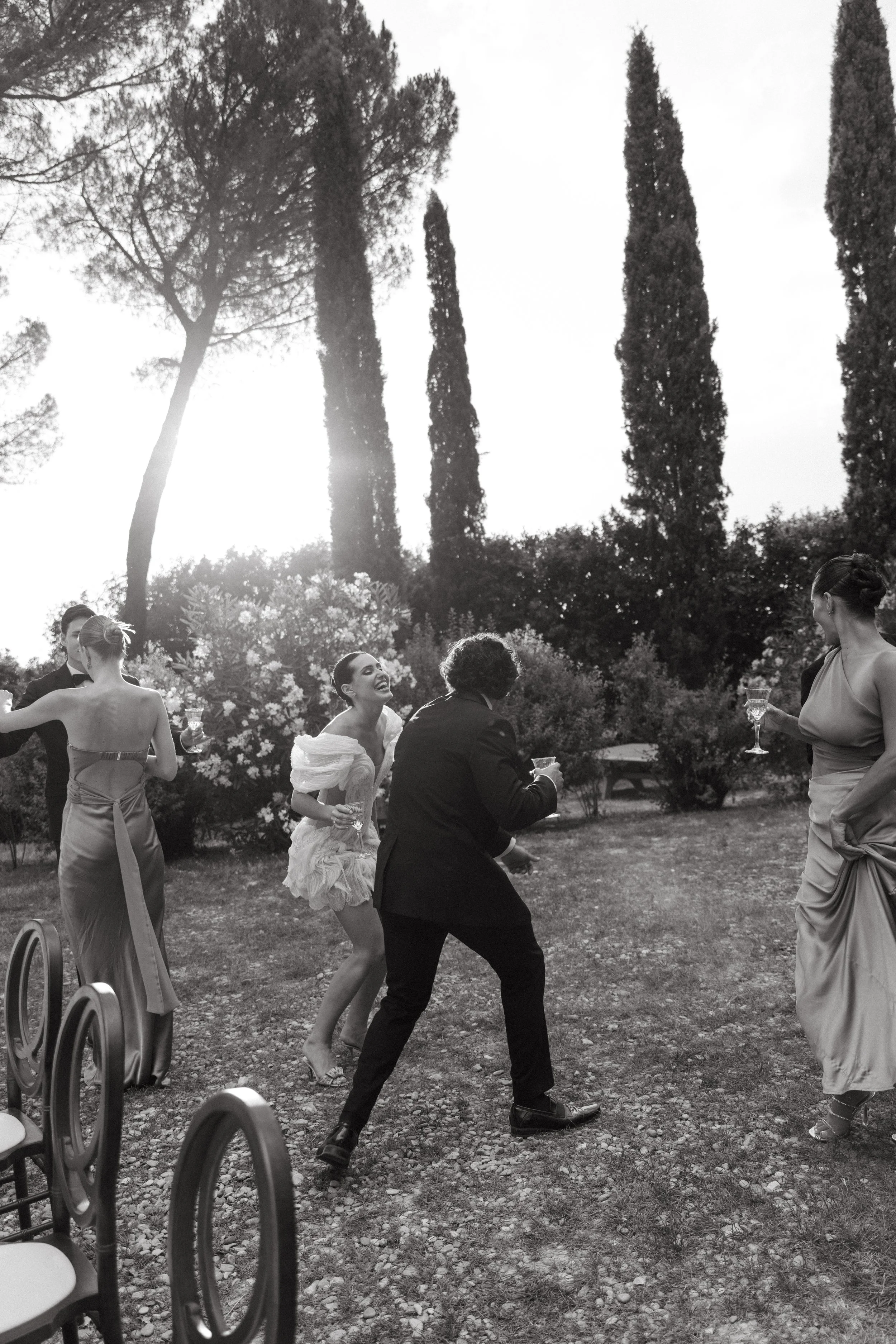 Guests dancing outside Villa Cozzano during intimate destination wedding in Tuscany