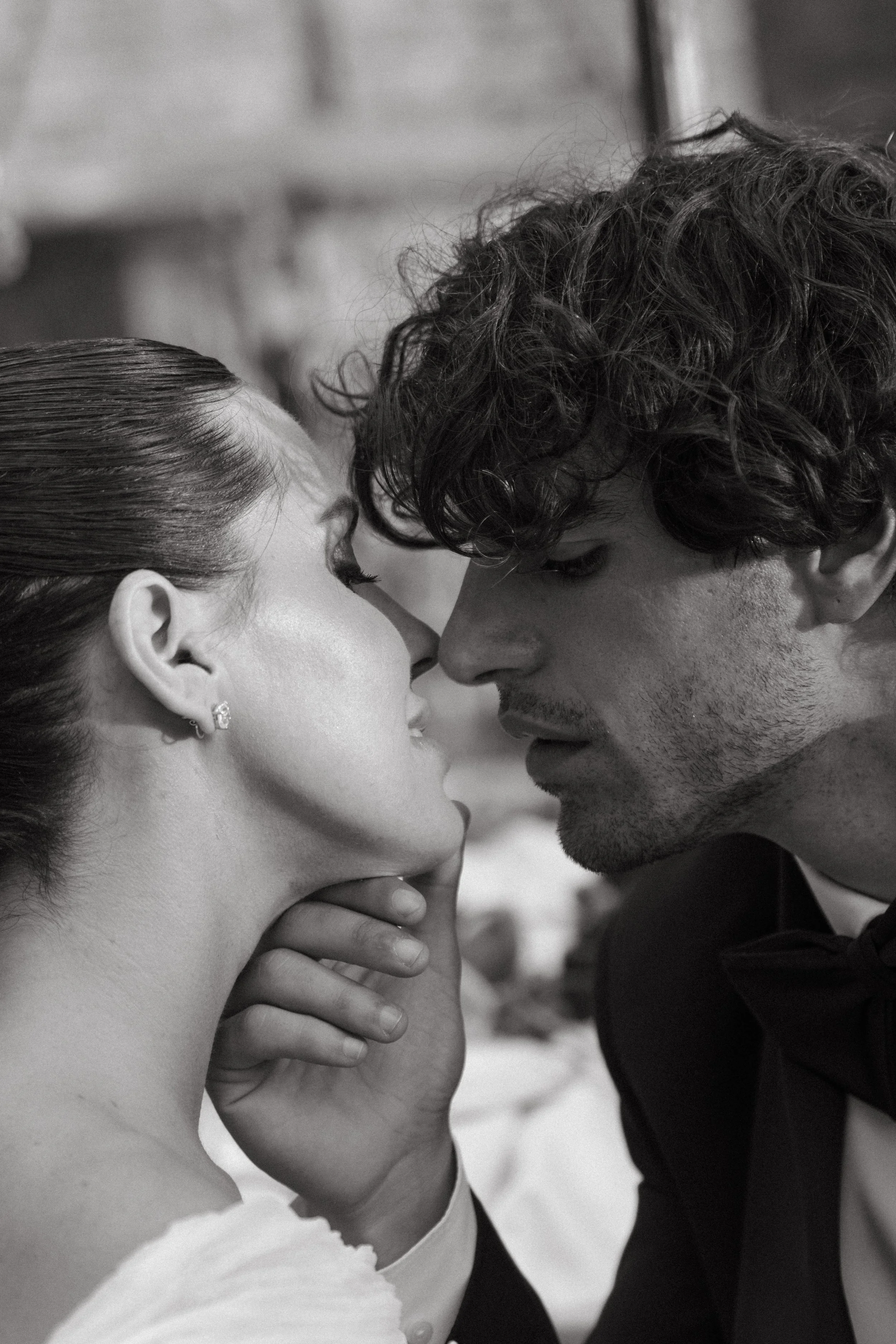 Bride and groom sharing a tender moment during Villa Cozzano Tuscany wedding editorial