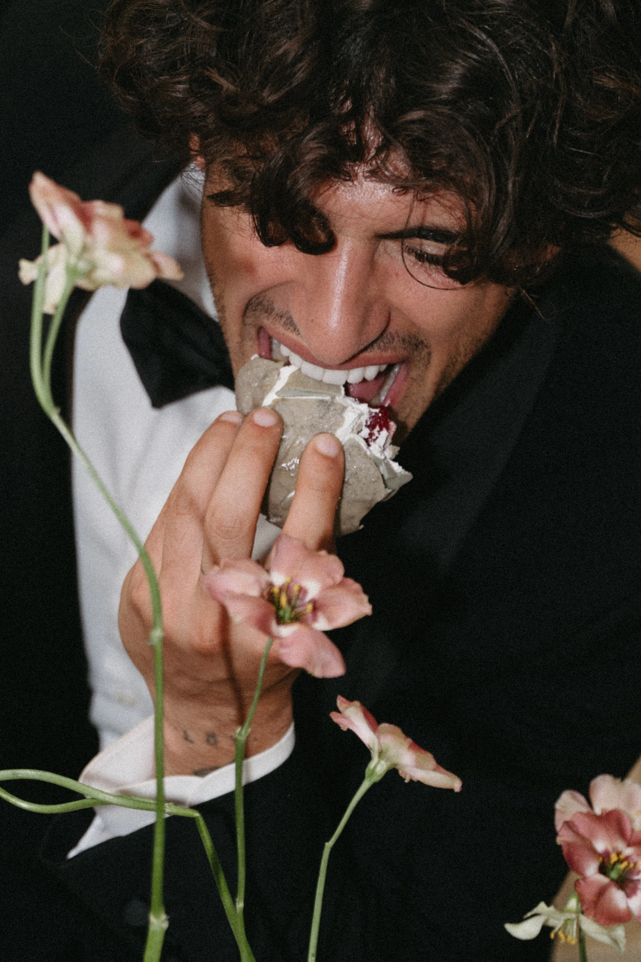 close up of groom enjoying ice cream wedding cake at tuscany wedding editorial shoot