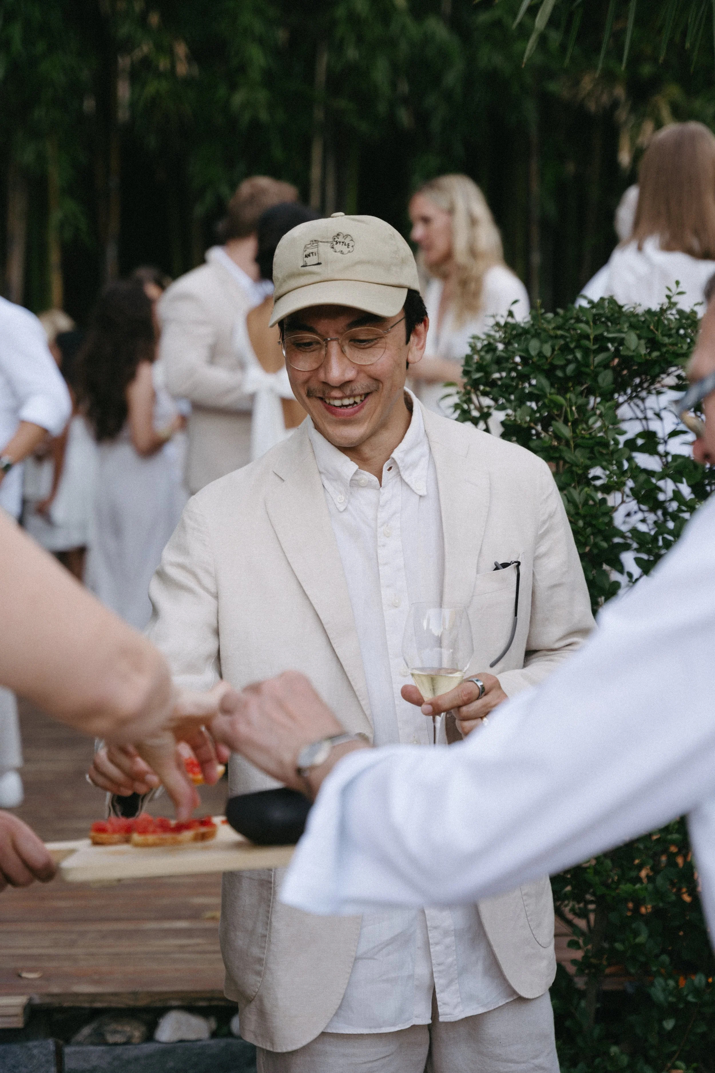 bride's brother enjoying canapes during the white welcome dinner at  Ristorante Da Enzo, Tegna
