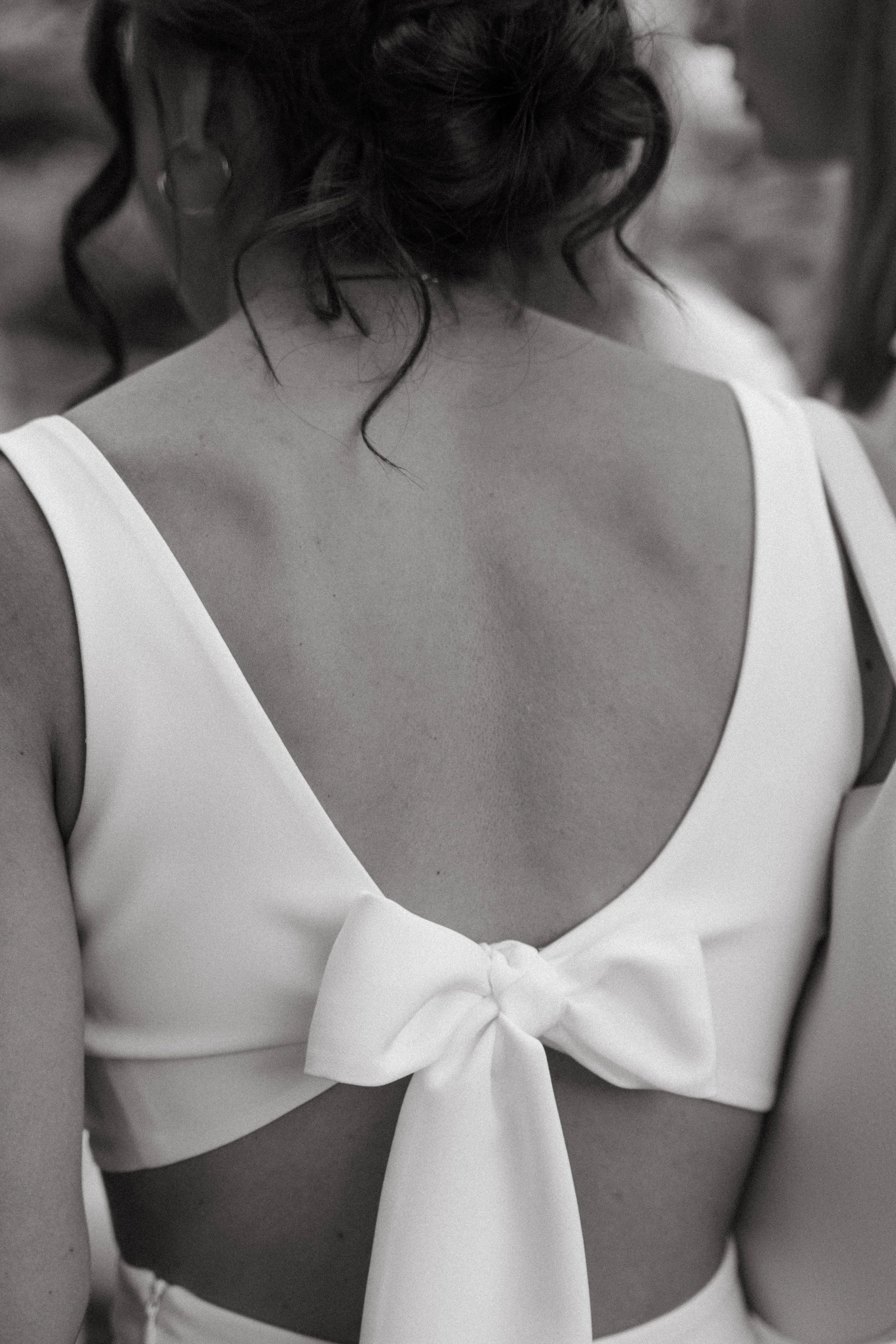 close up shot of the back of bride's outfit 
