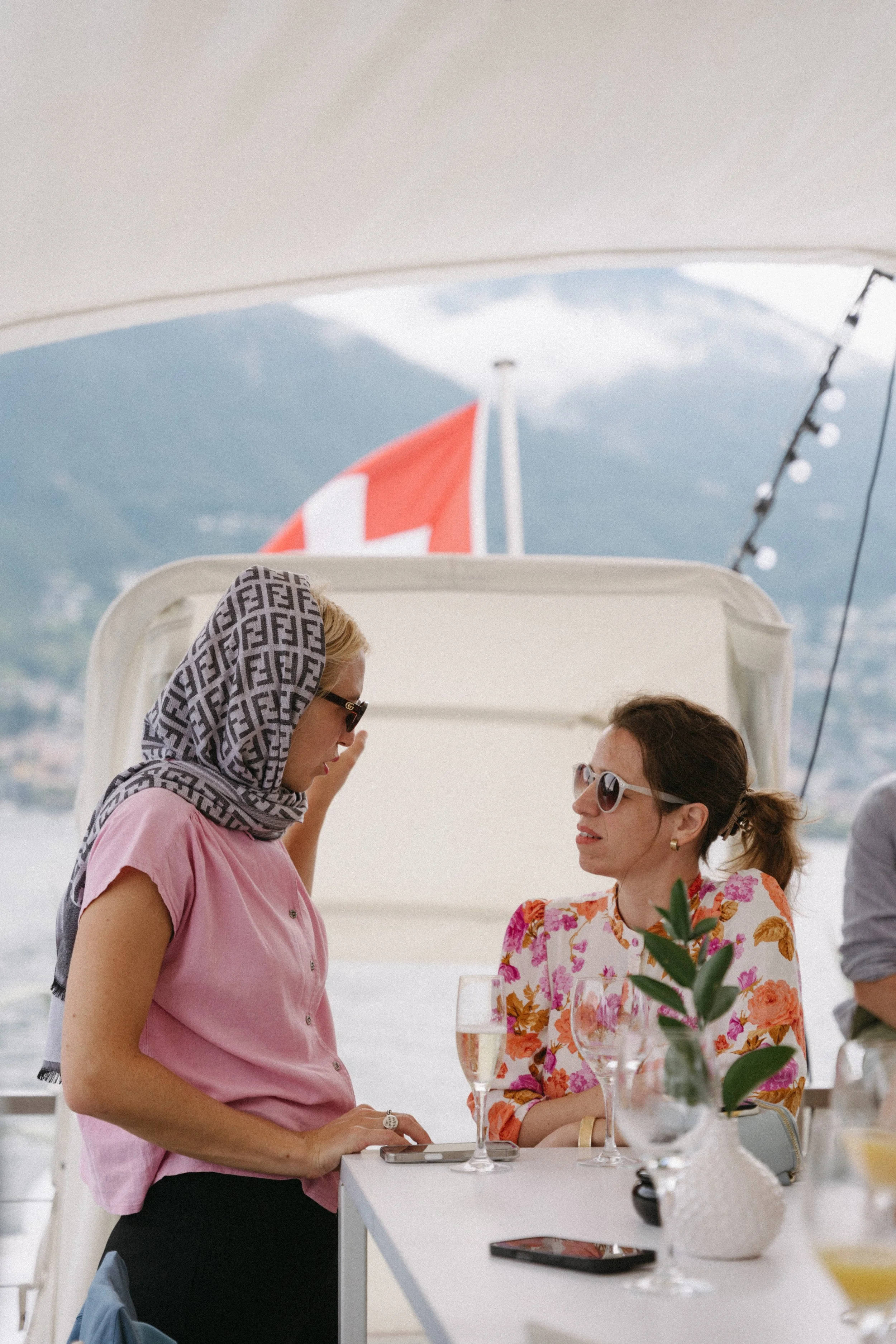 Documentary-style capture of guests chatting on the boat