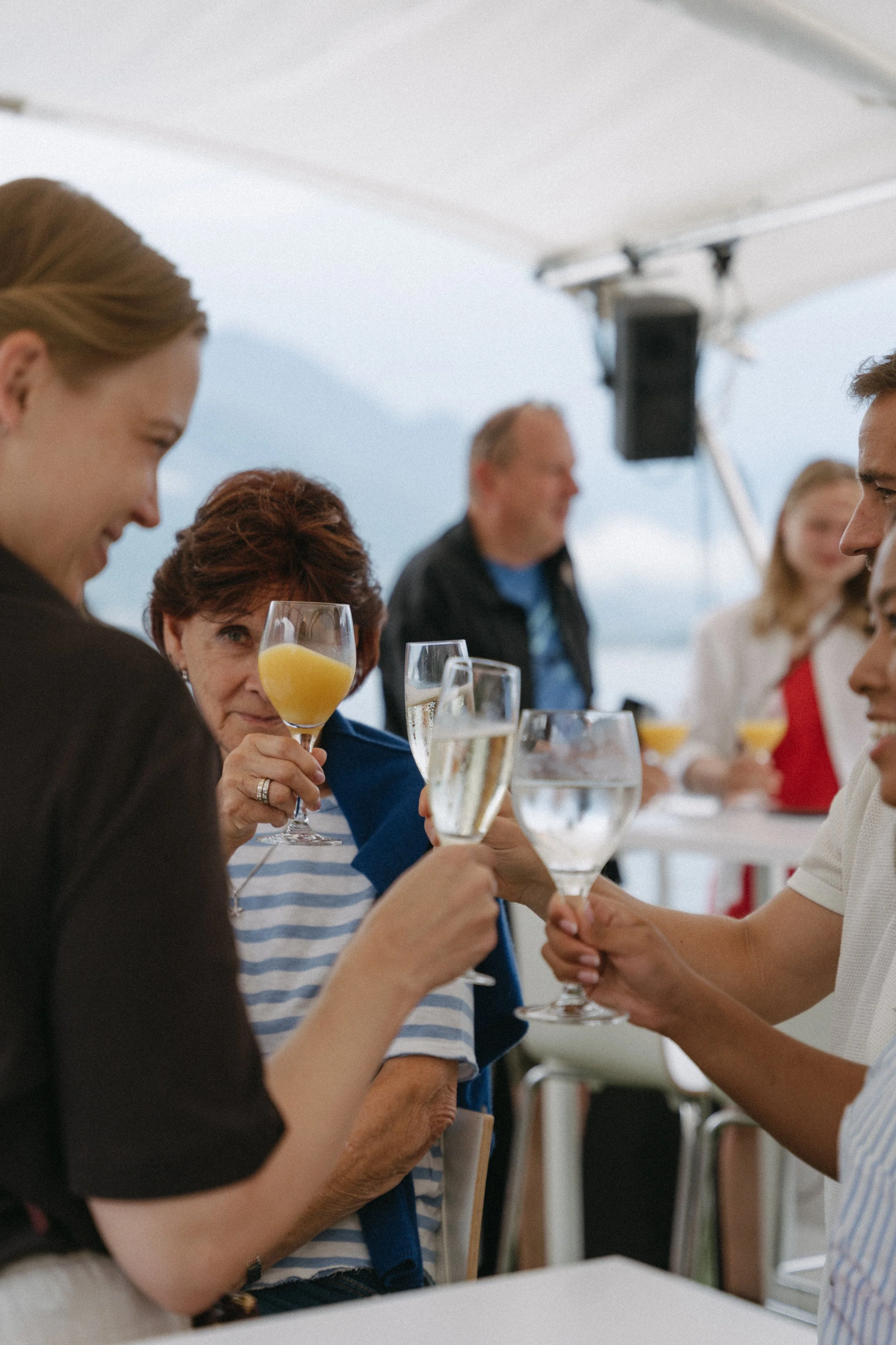 Champagne toast on the water during the Lago Maggiore pre-wedding celebration