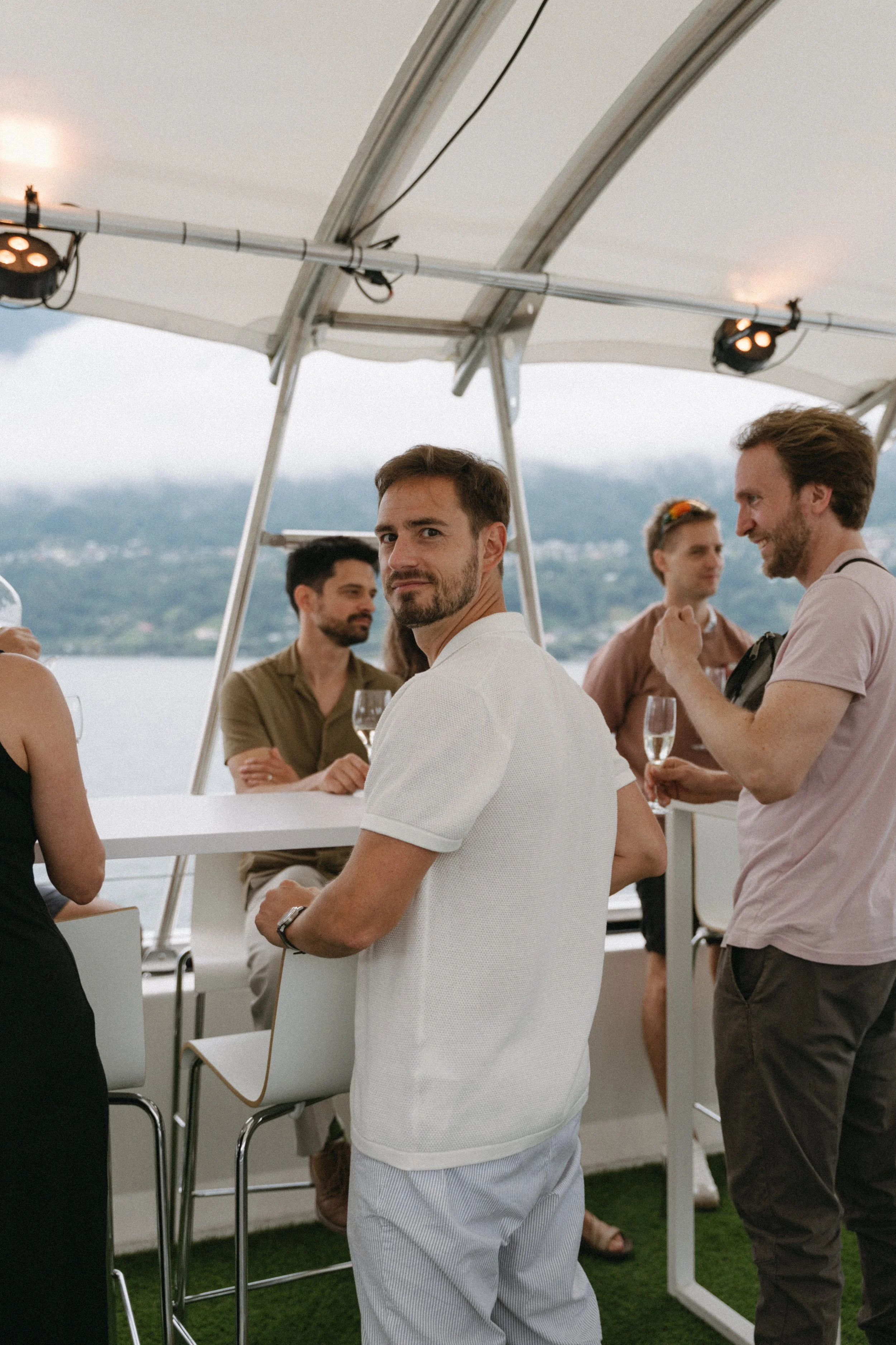 candid photo of groom during pre-wedding lake cruise around lago maggiore