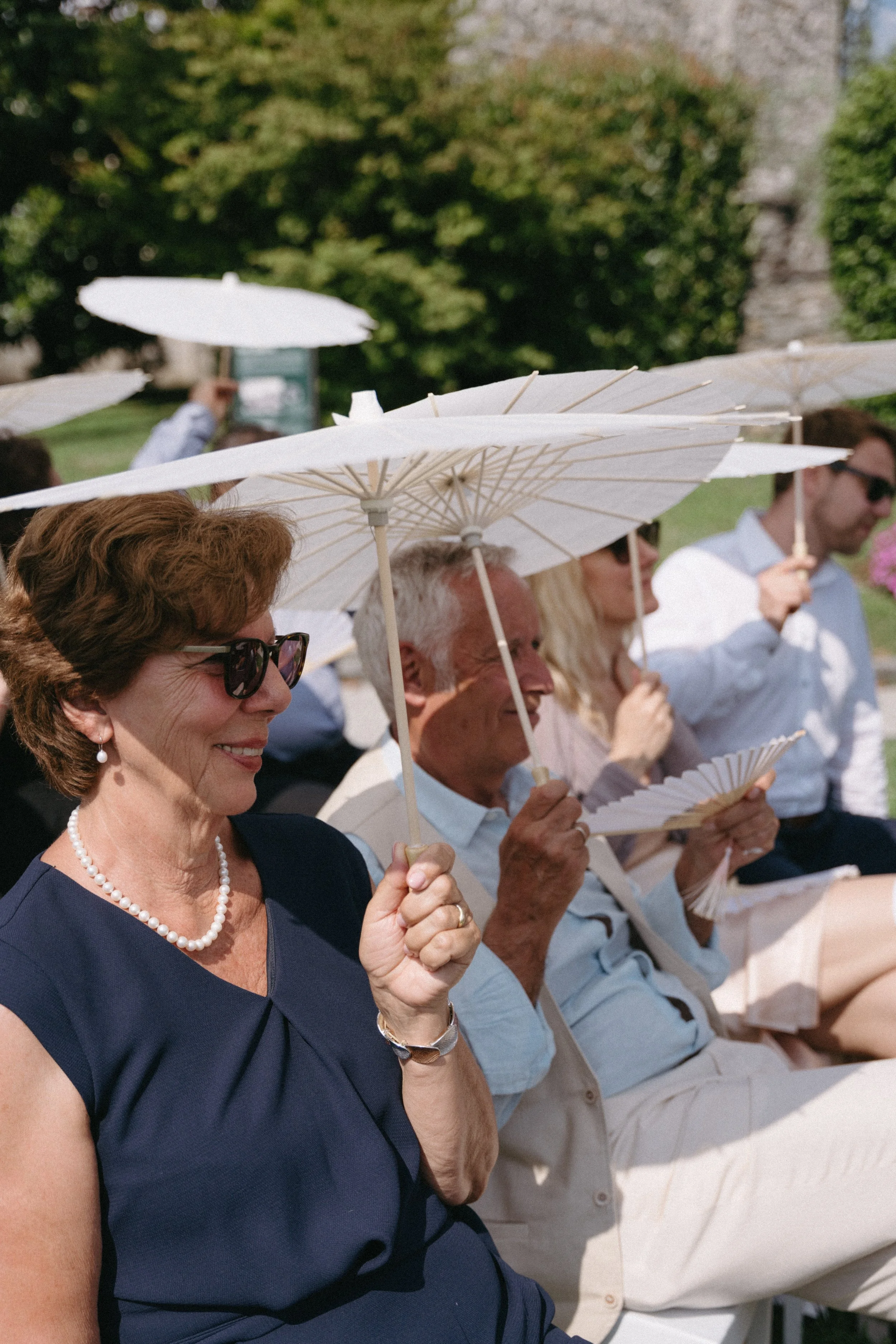 Guests seated in the garden courtyard for the Villa San Quirico ceremony