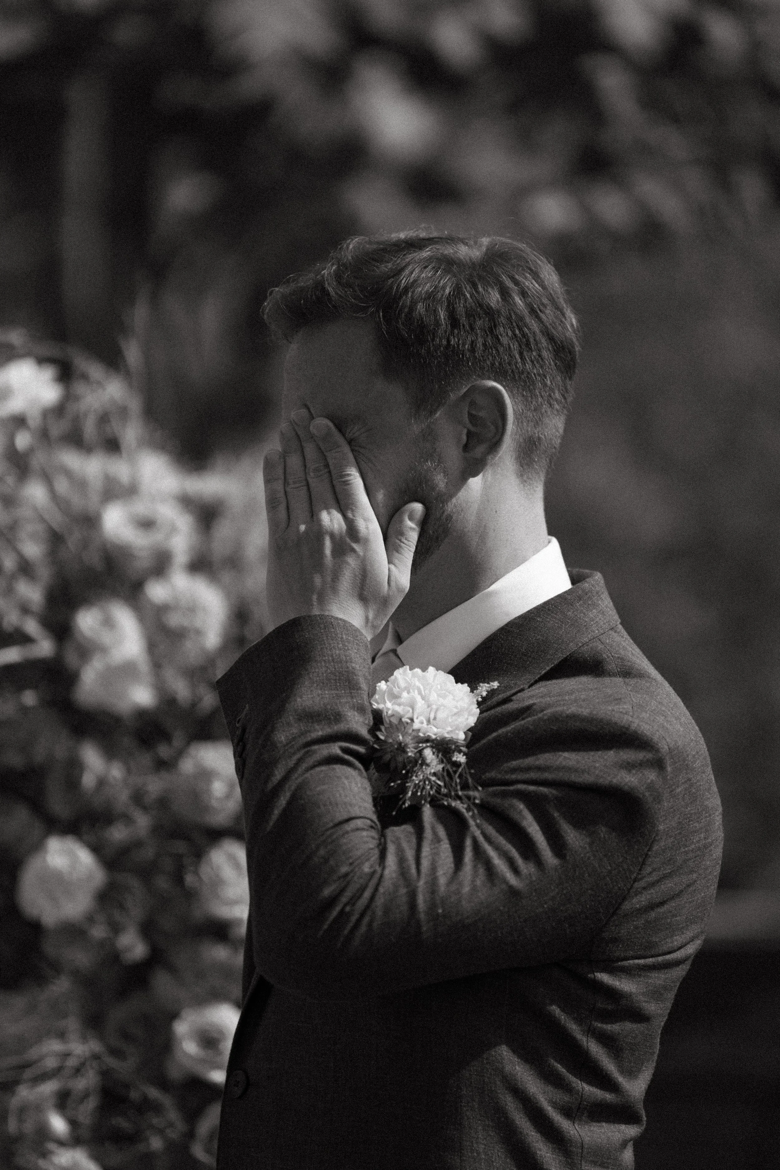 groom wiping away tears during heartfelt wedding vows in Switzerland