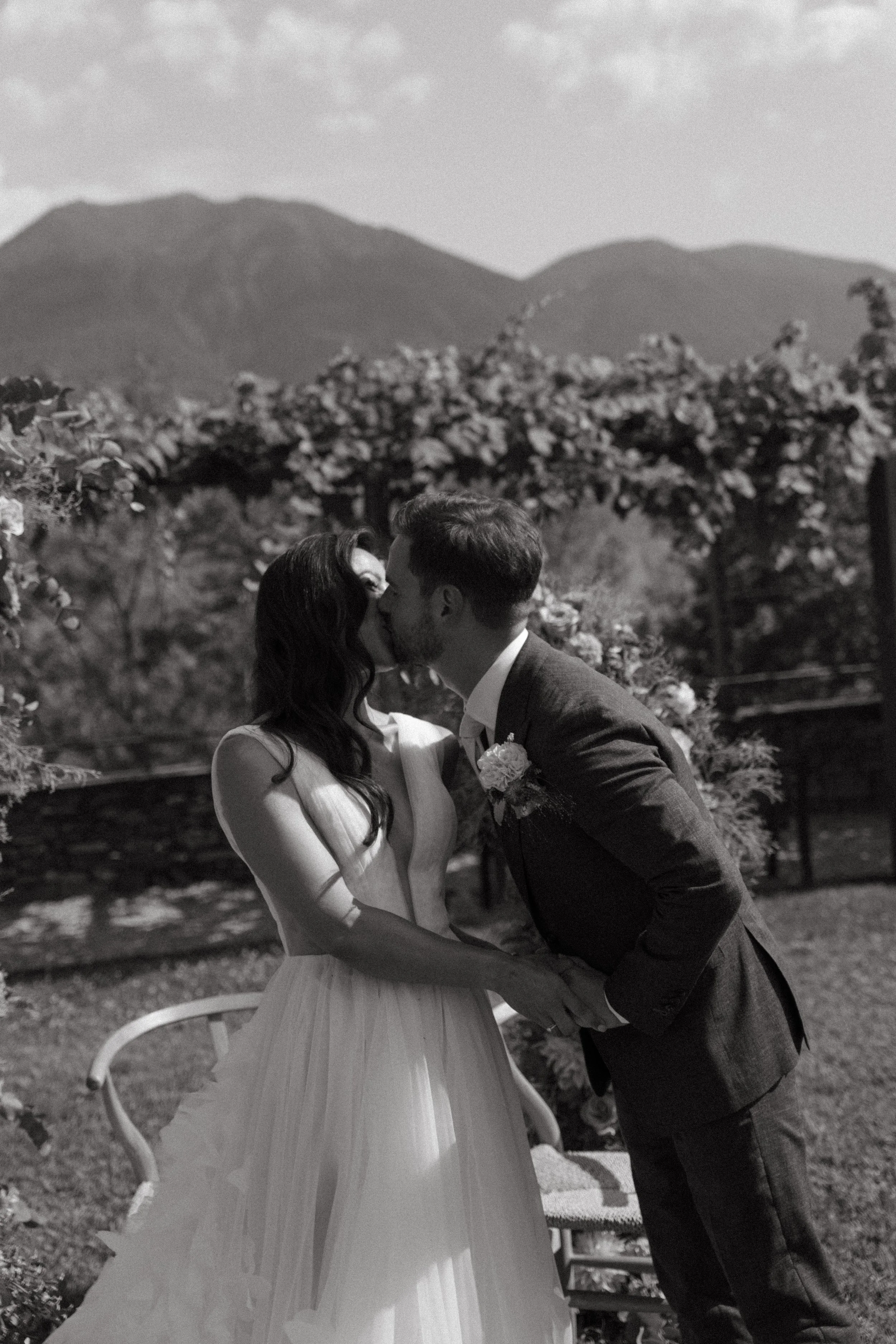 Candid moment as the couple shares their first kiss under the Swiss summer sun