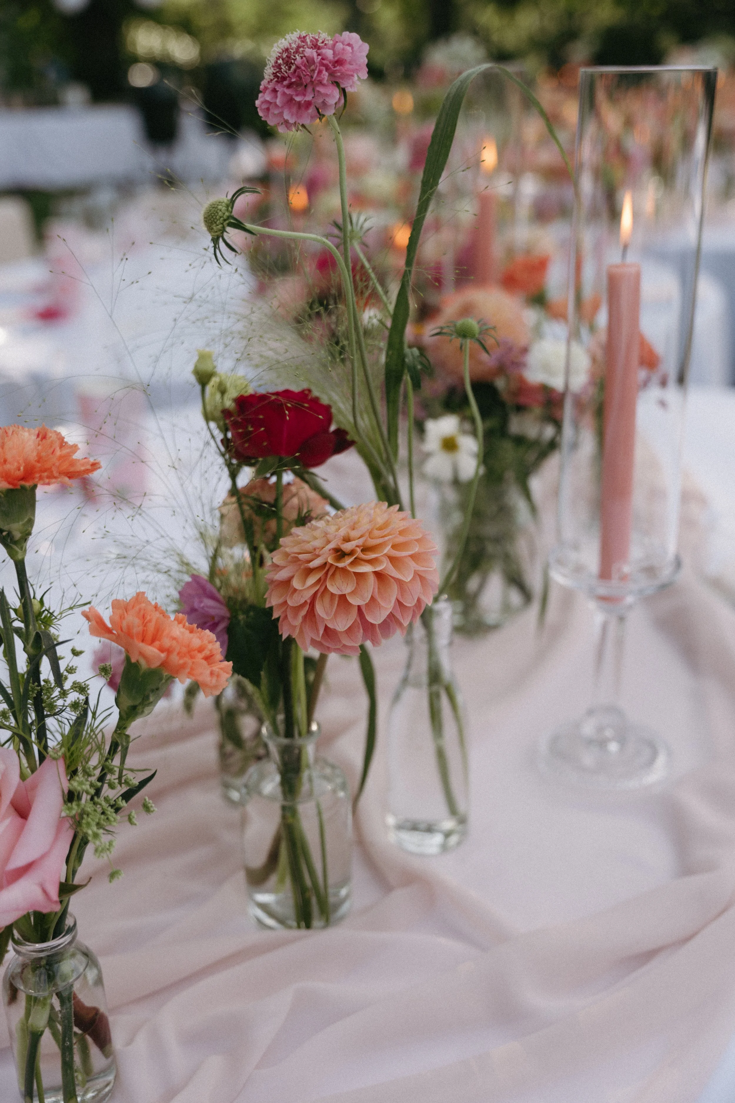 detail shot of colourful florals and candles for intimate micro-wedding tablescape