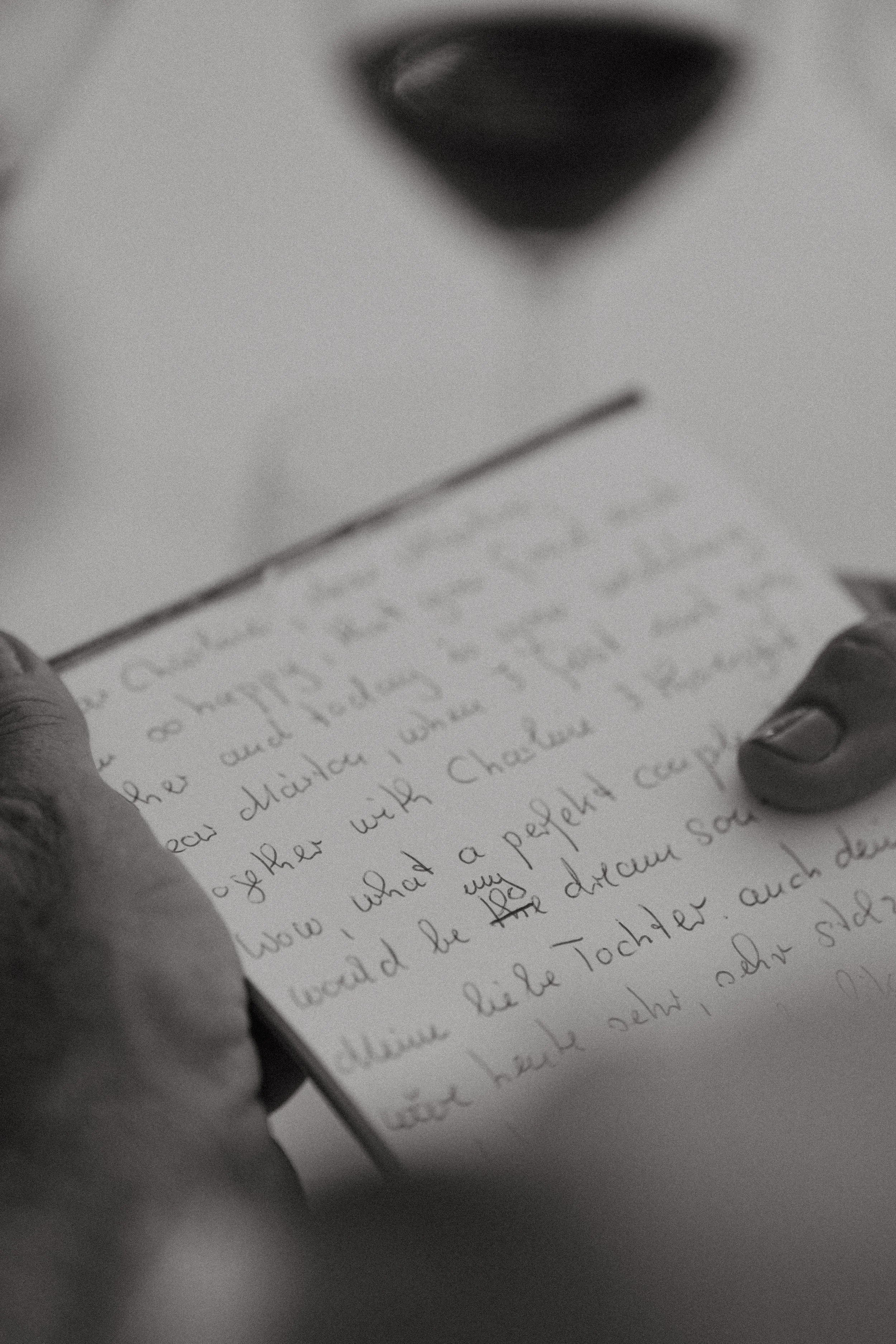 close up shot of handwritten wedding speech during reception 