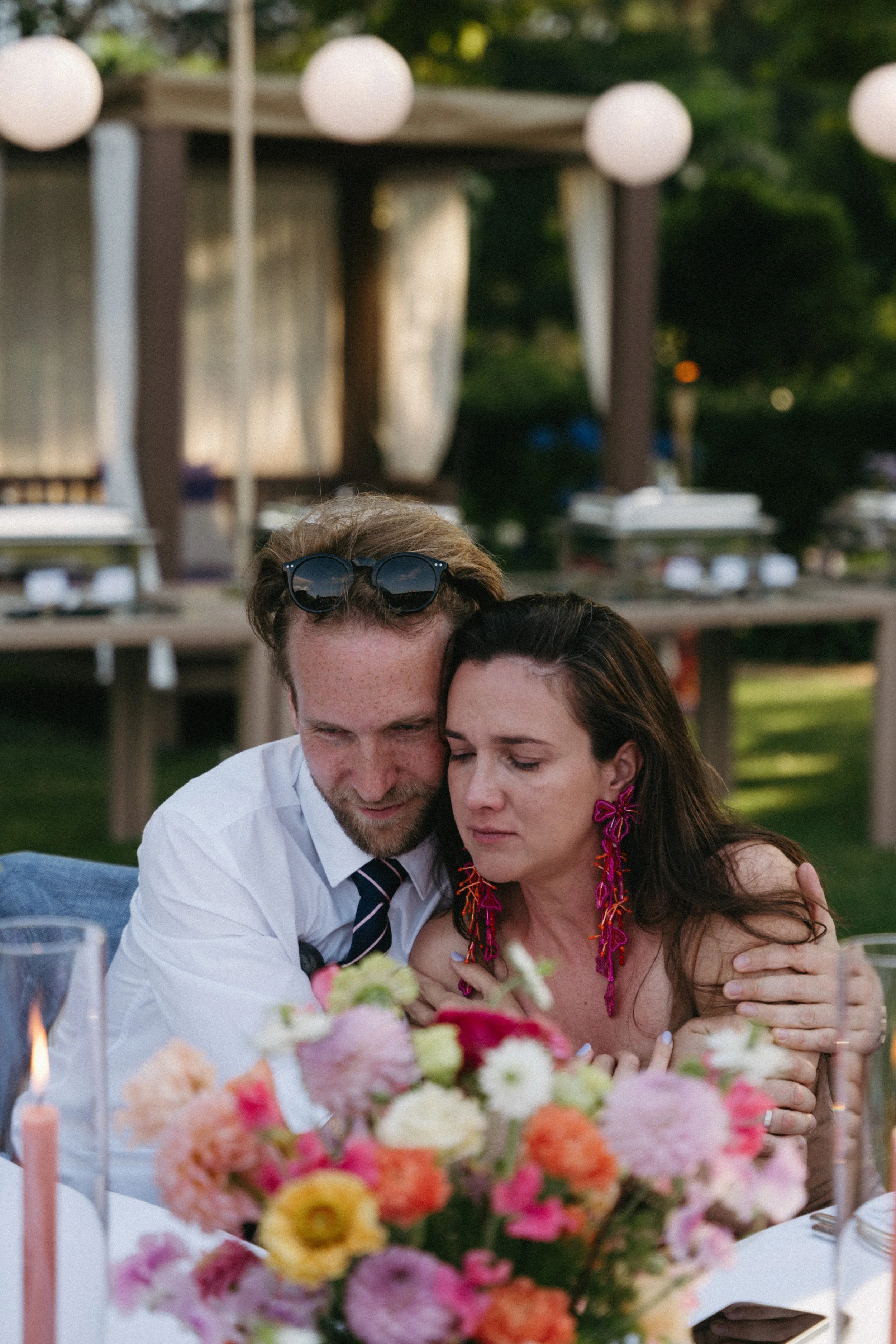 wedding guests embracing during emotional wedding speeches