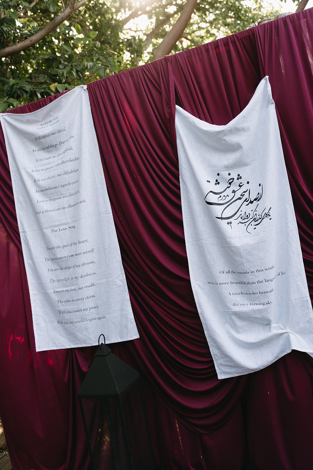 fabric signage draped on red velvet at cape fahn wedding reception
