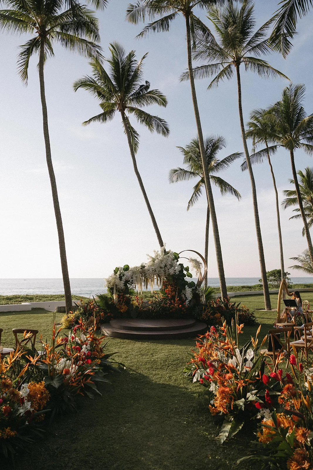 stunning floral organic wedding arch setup for beachfront ceremony at elite havens