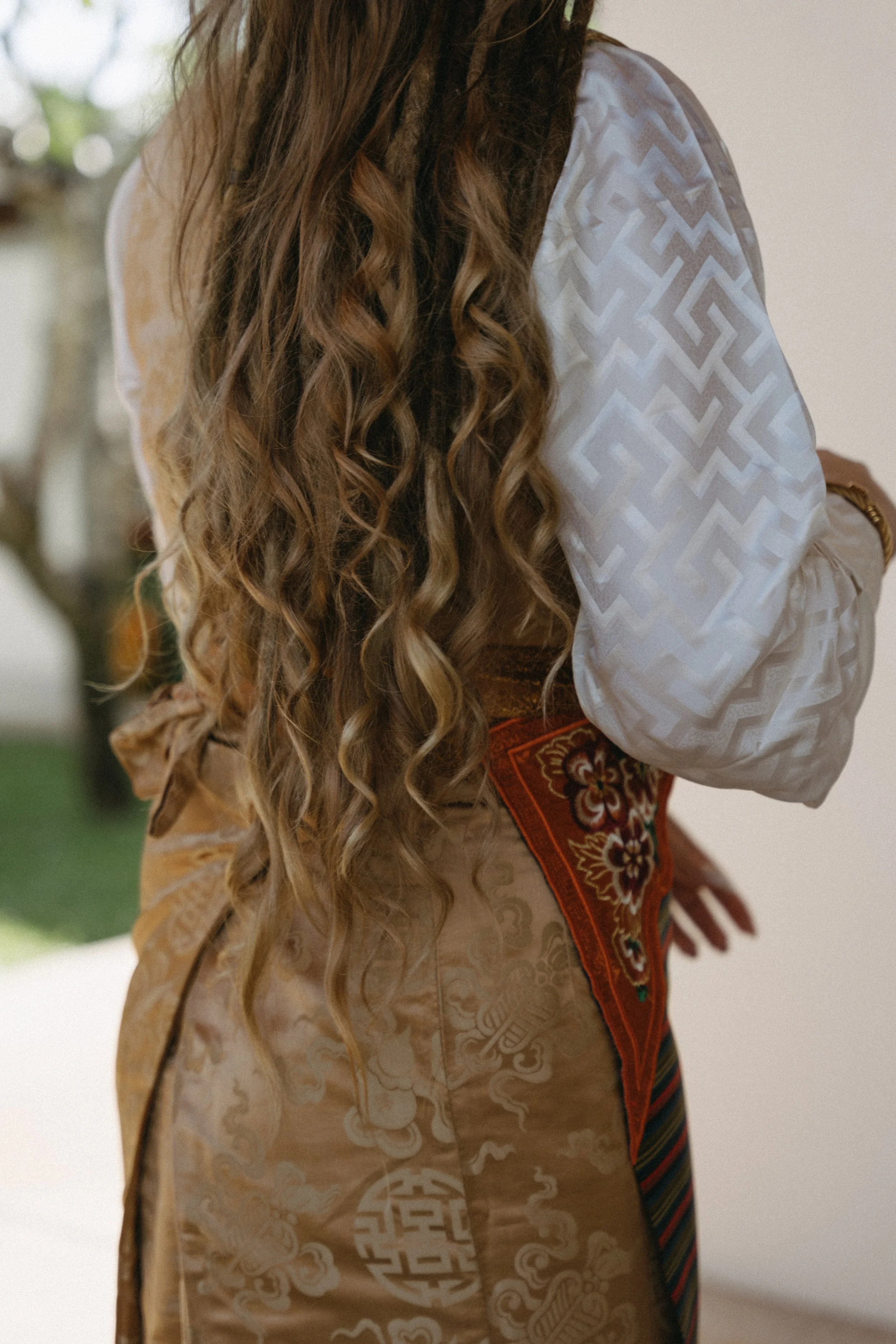 close up shot of bride's long hair styled for Sikkimese Buddhist ceremony