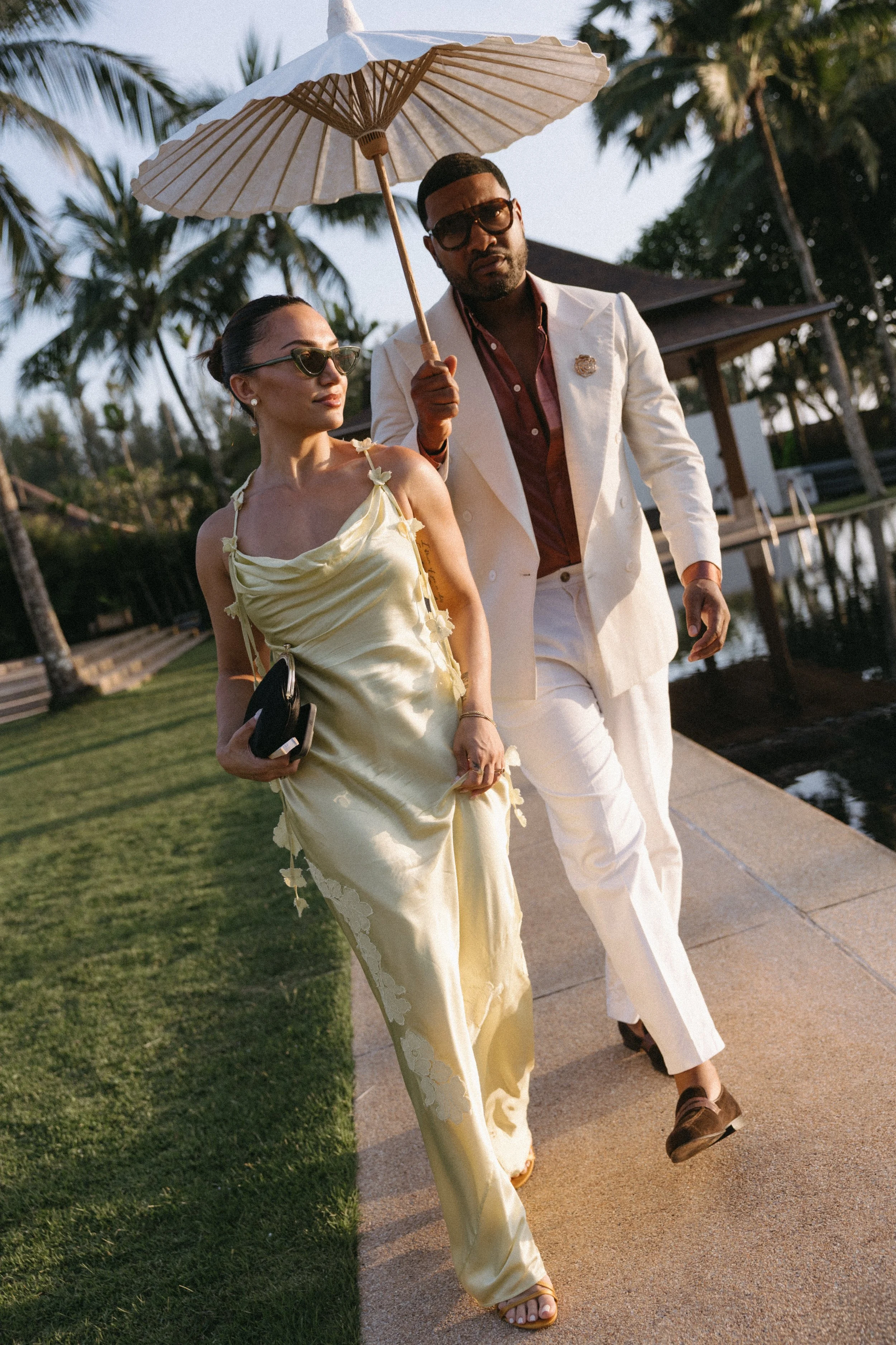editorial shot of stylish guests arriving for the western wedding ceremony at jivana beach villas