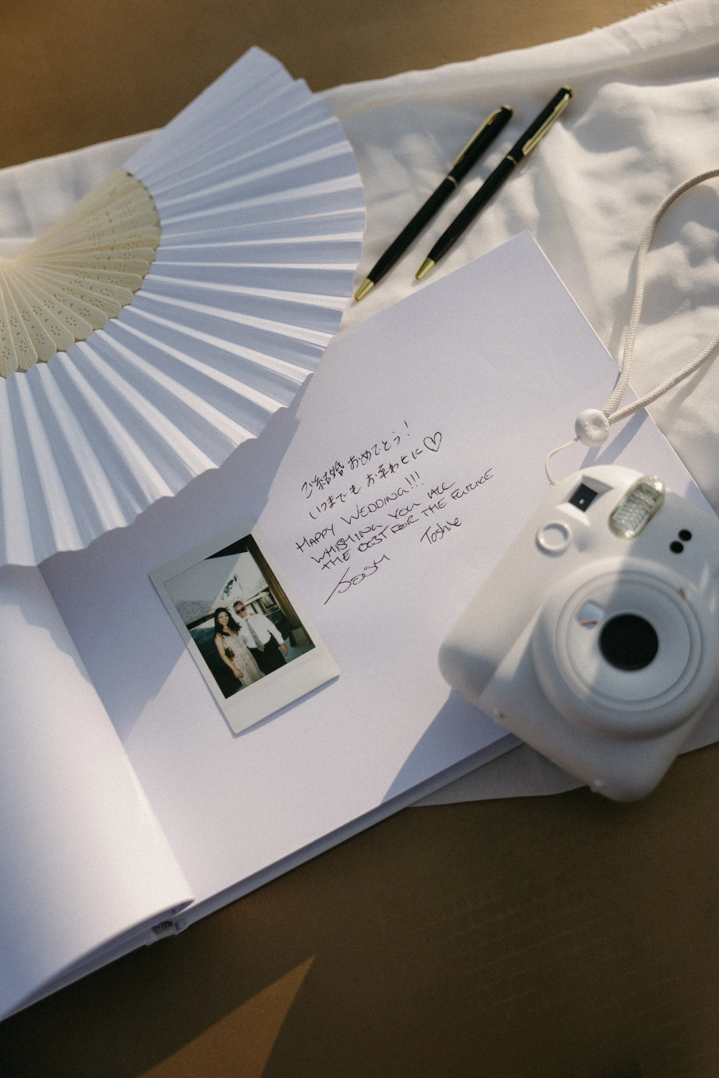 handwritten note and polaroid in the wedding guest book 