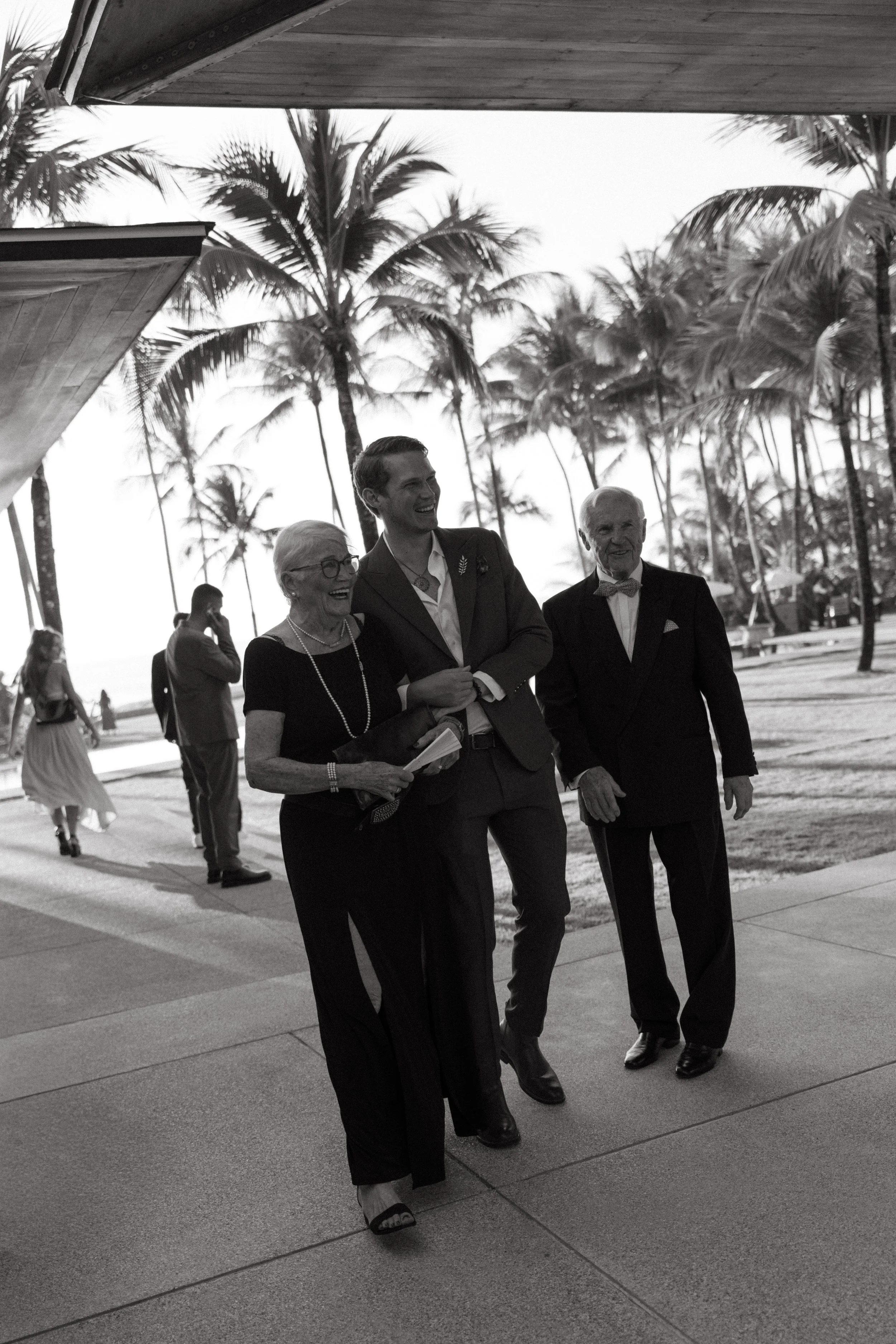 smartly dressed guests arriving for intimate destination wedding ceremony at jivana beach villas