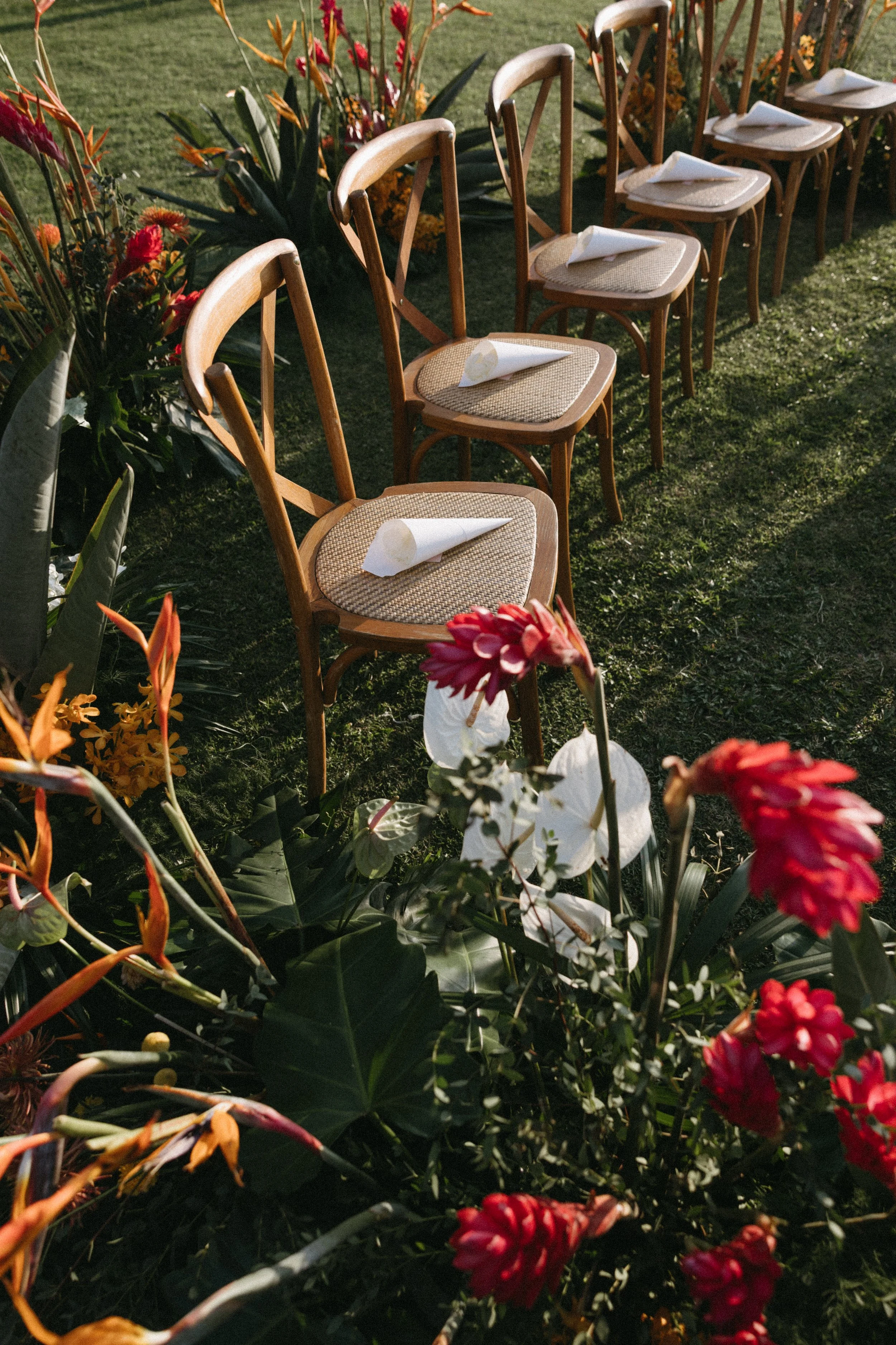 rattan bentwood chairs set up for outdoor wedding ceremony at jivana beach villas