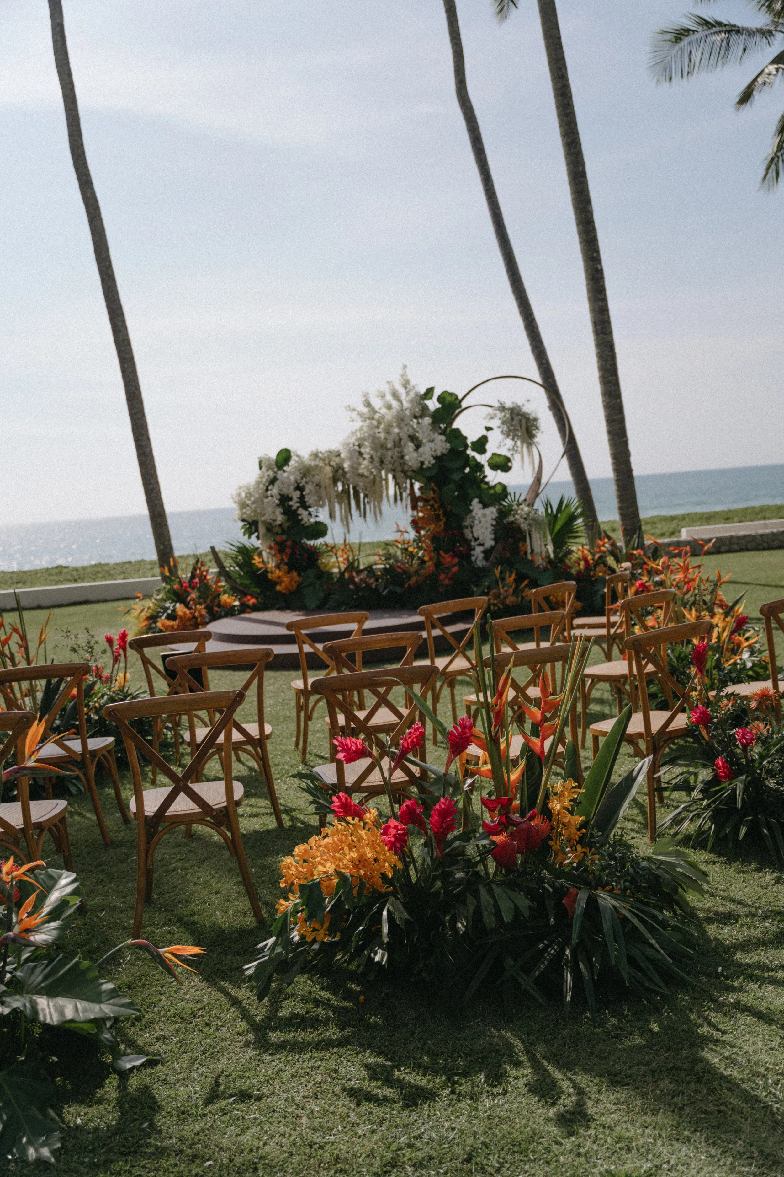 portrait of outdoor wedding ceremony setup overlooking the ocean before guests arrive