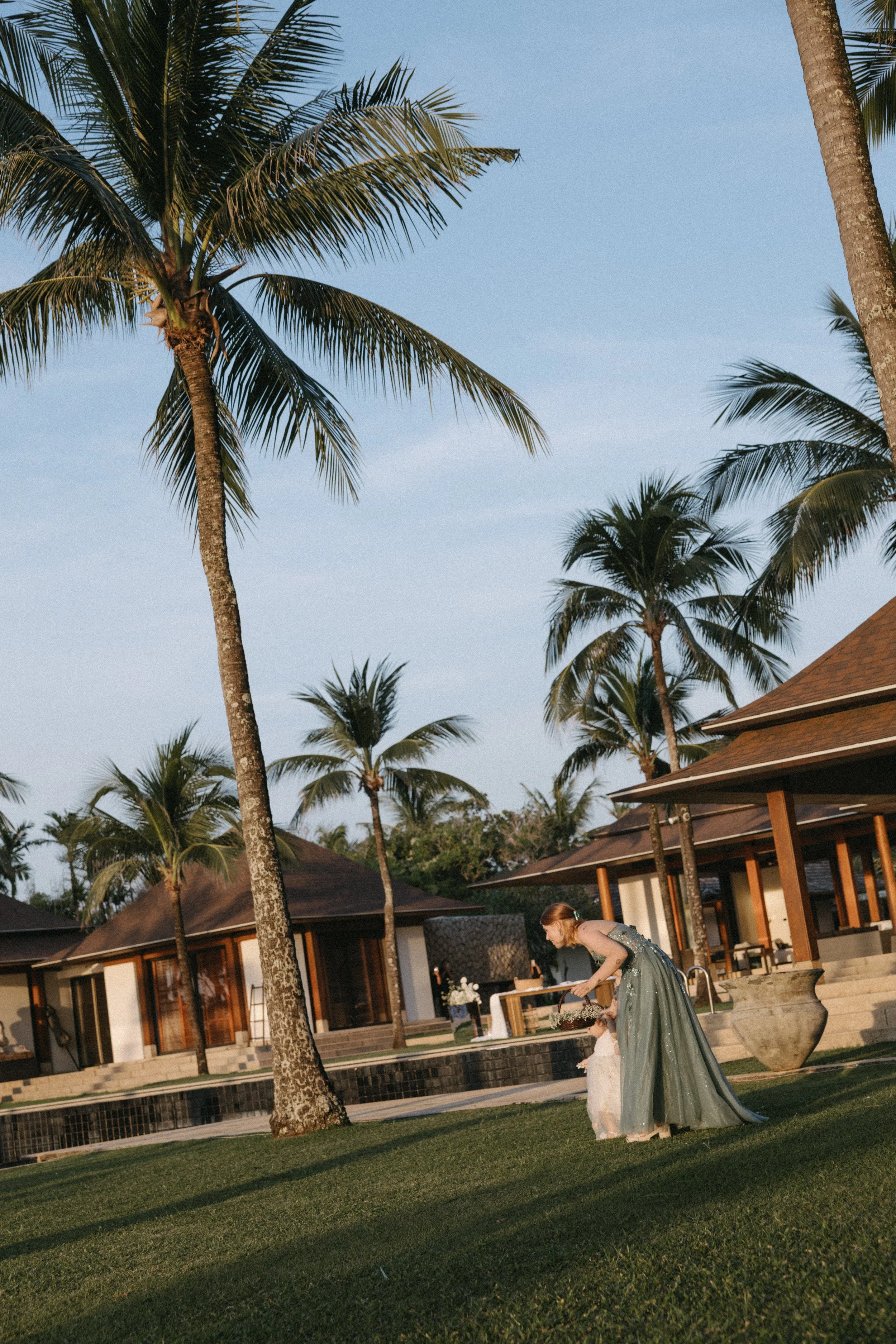 flower girl arriving for intimate destination wedding ceremony at jivana beach villas