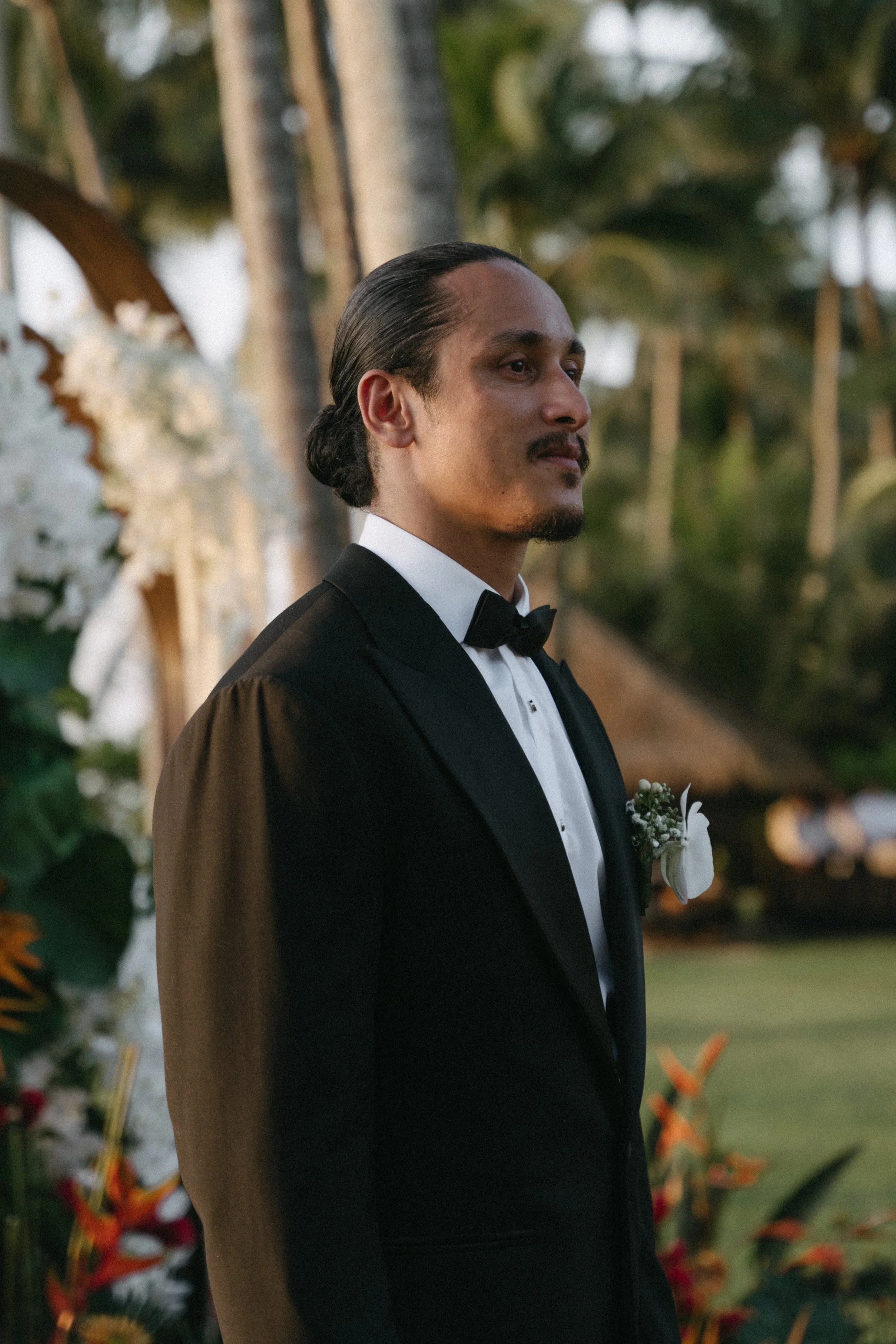 close up of groom waiting for bride to arrive for wedding ceremony at villa shanti