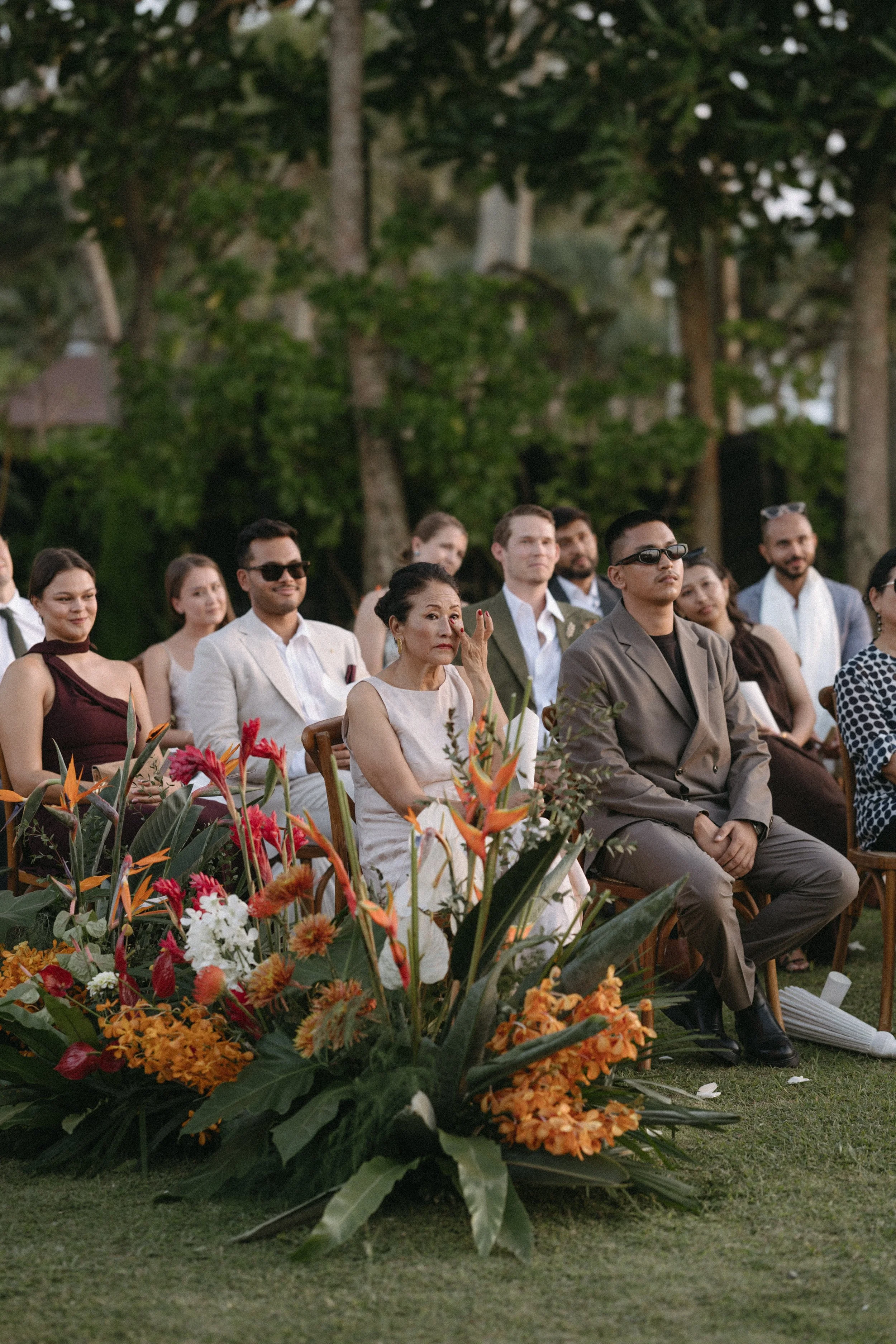 candid portrait of guests' emotional reaction during the intimate outdoor wedding ceremony 