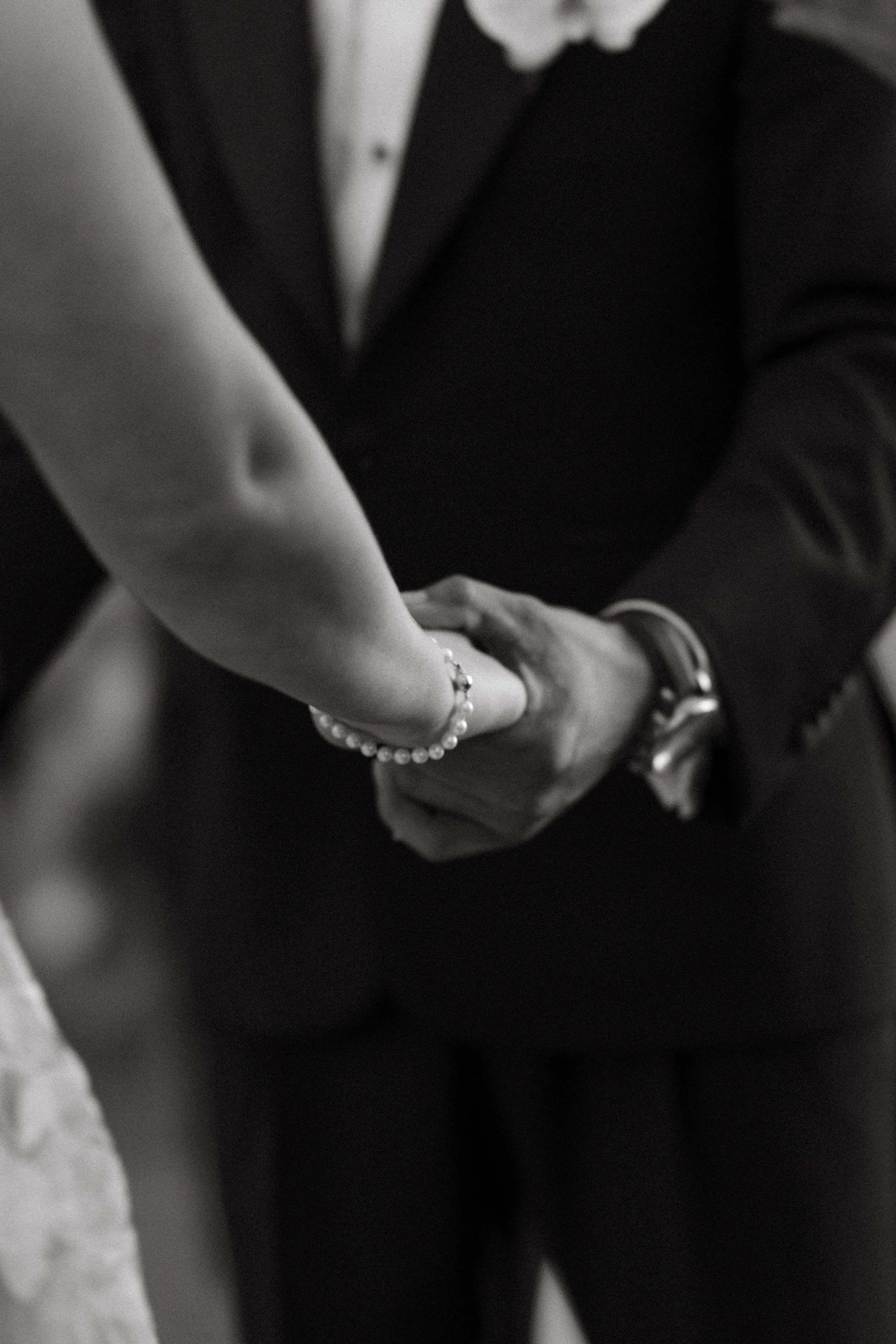 couple holding hands during vows at their intimate destination wedding ceremony 