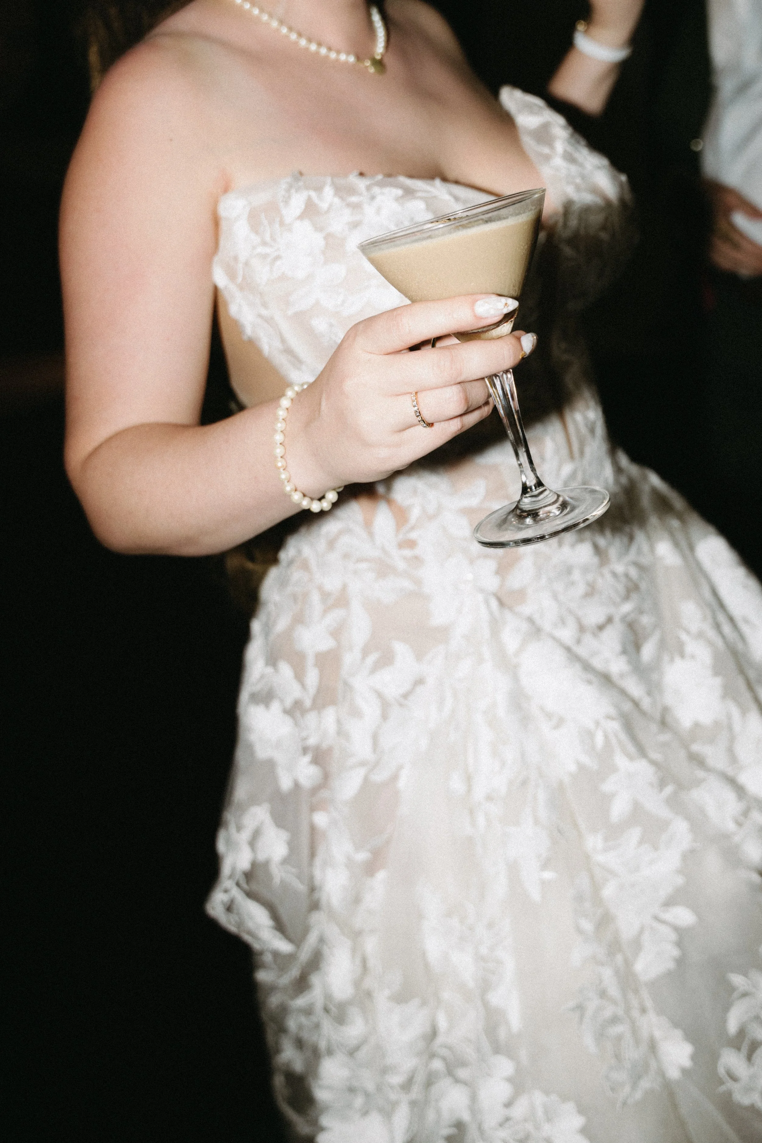 close up of bride holding cocktail during drinks before the wedding reception at jivana beach villas