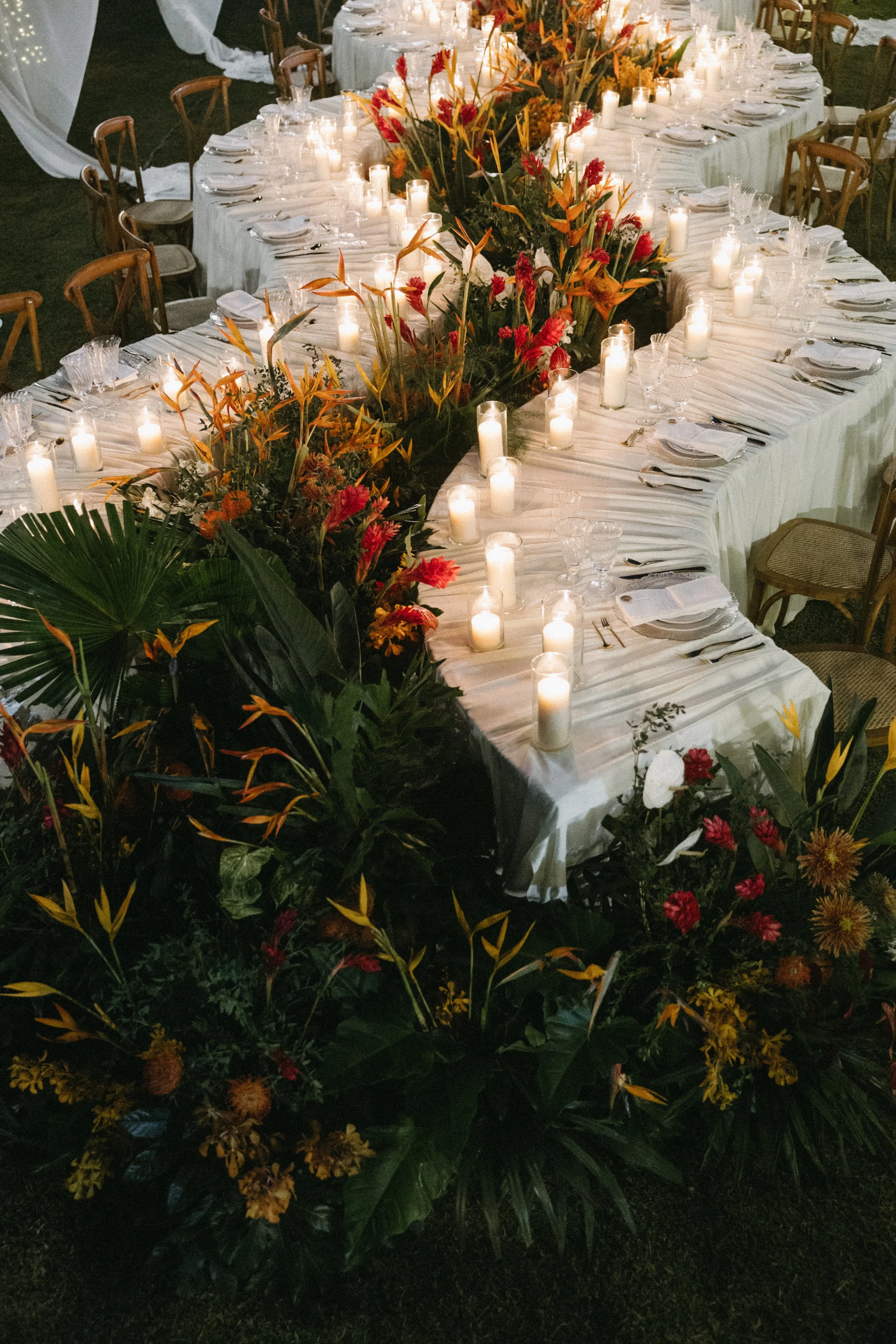 editorial portrait of tropical outdoor destination wedding reception set up in phang nga thailand