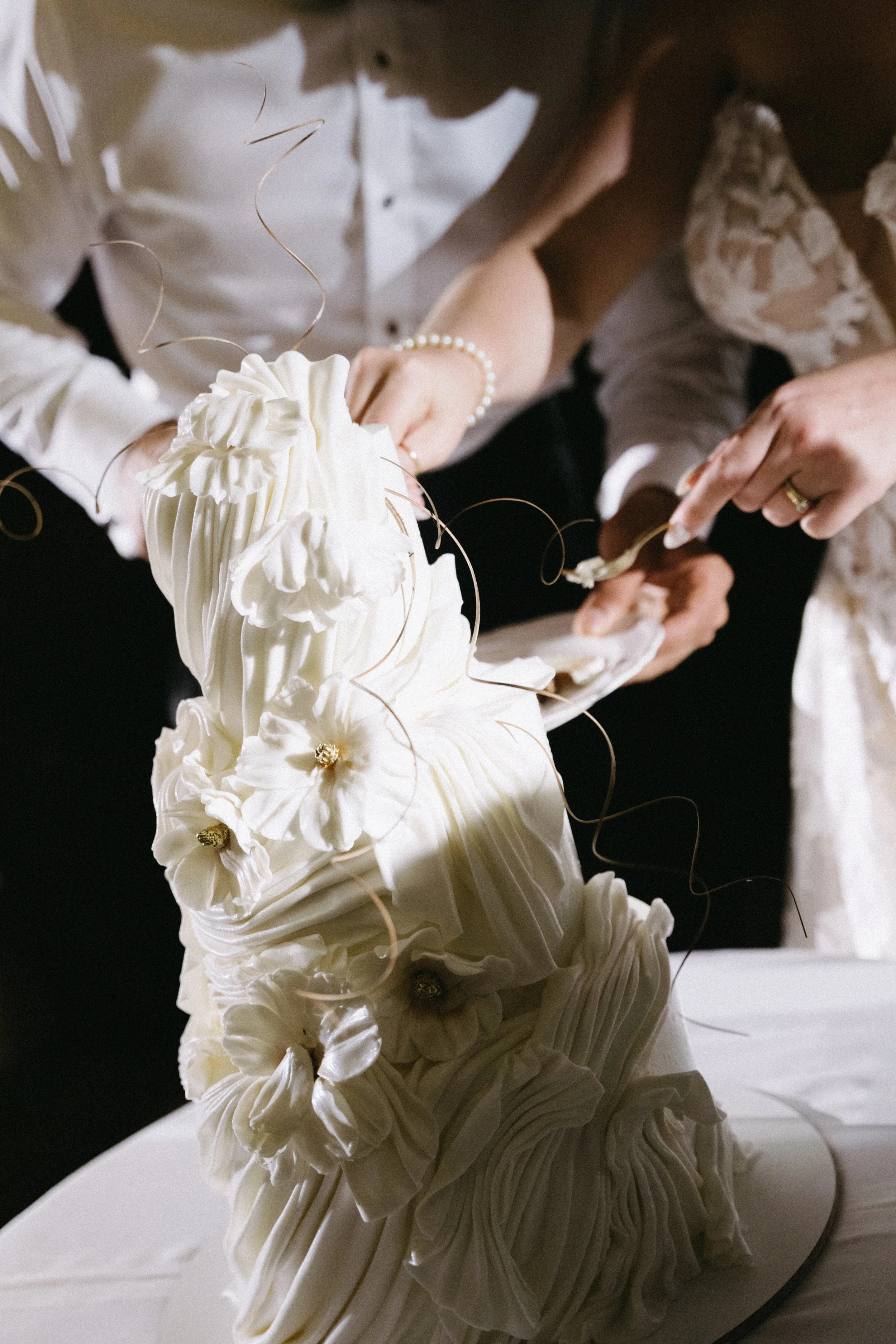 close up of couple cutting their wedding cake during intimate wedding reception 