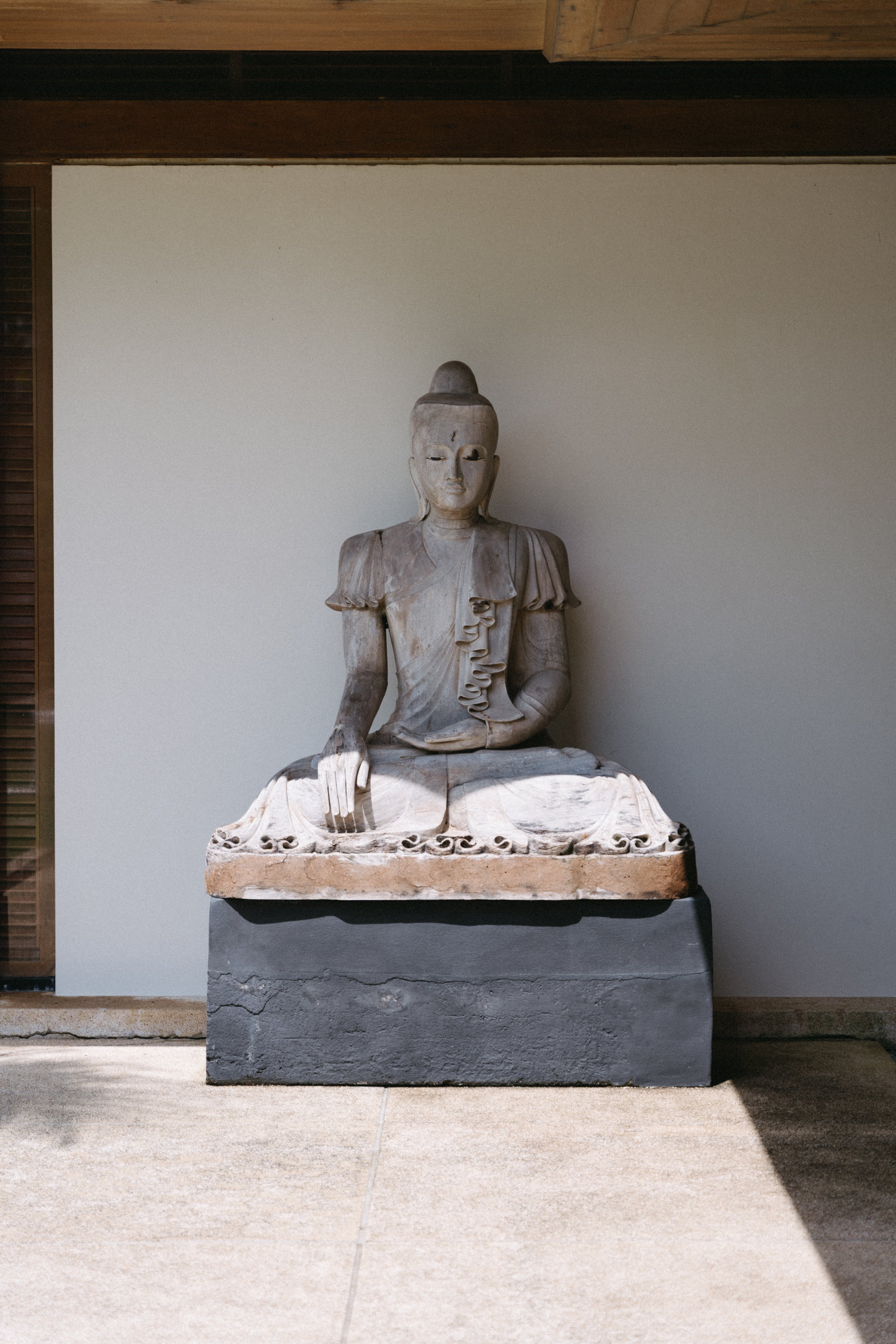 stone statue of buddha at Jivana Beach Villas