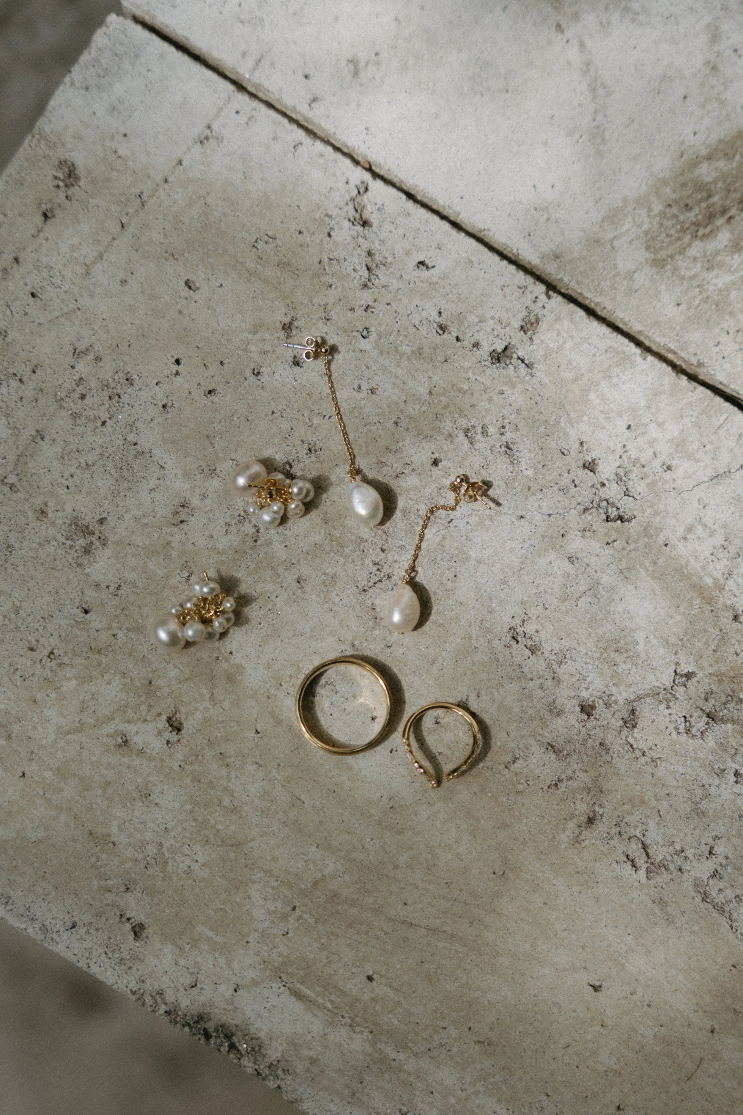 bridal jewellery elegantly styled on concrete surface
