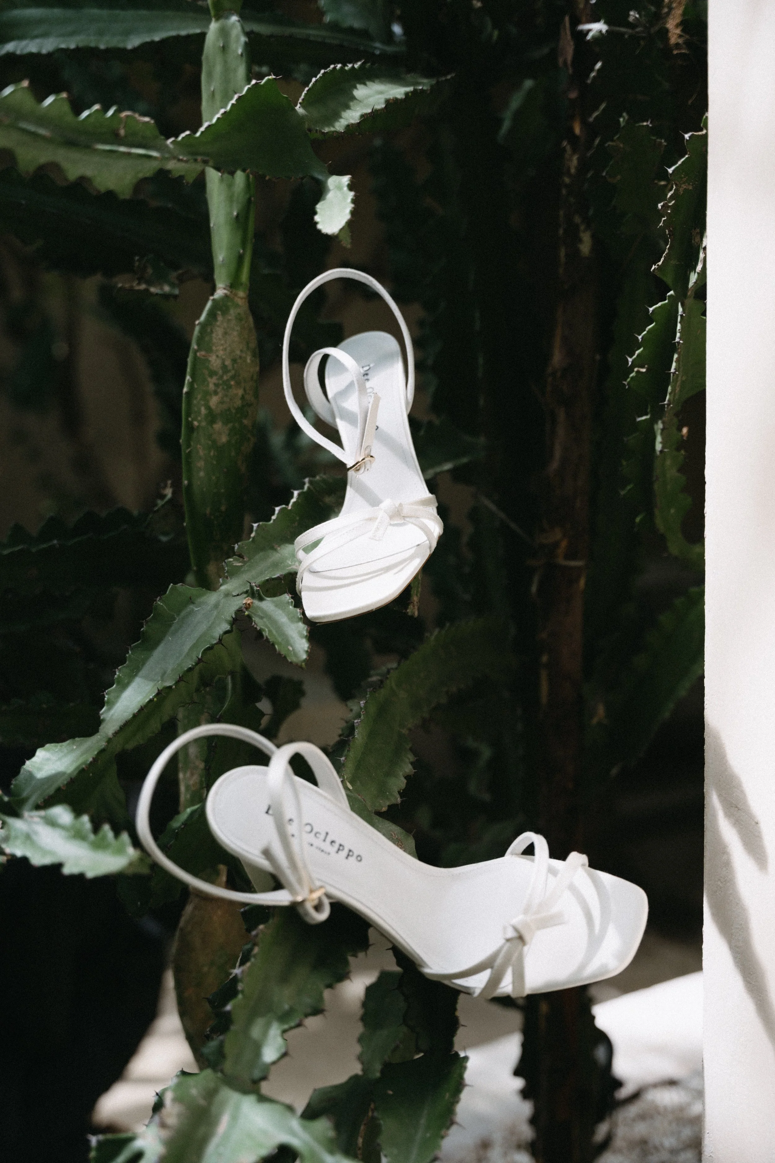 bride's wedding heels elegantly styled on greenery