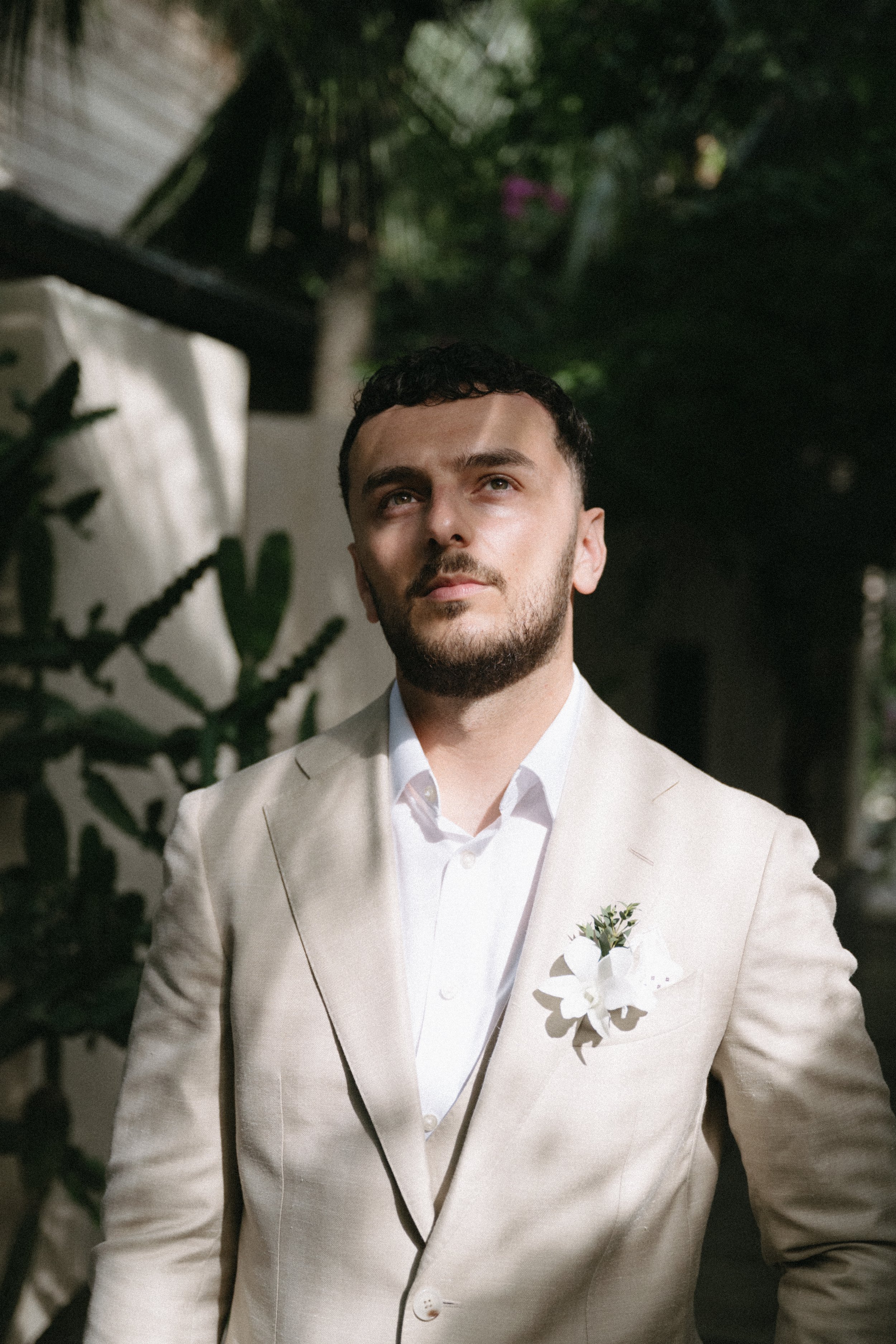elegant portrait of groom in his wedding suit before koh samui destination wedding ceremony