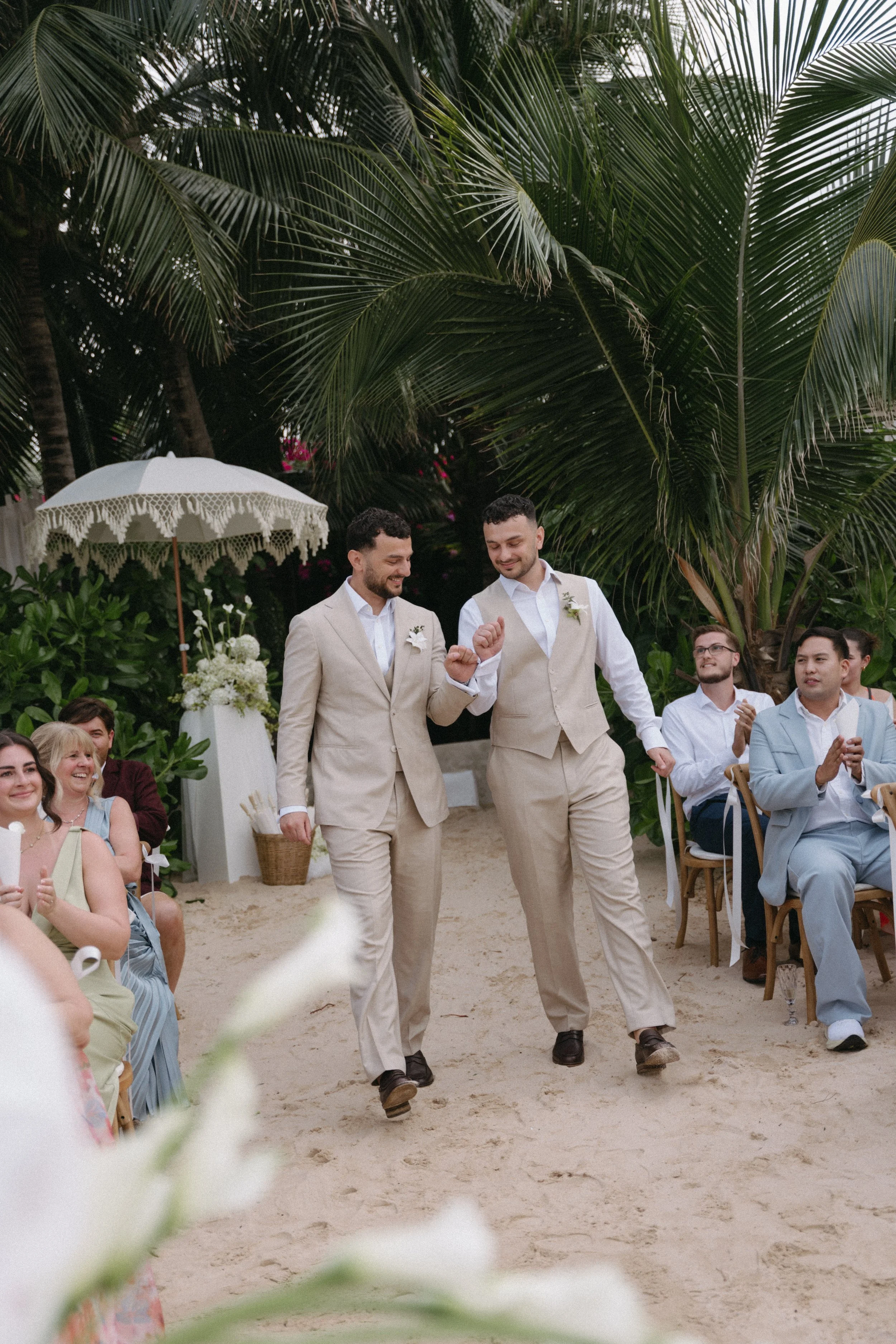 groom arriving for ceremony with groomsman on bangrak beach