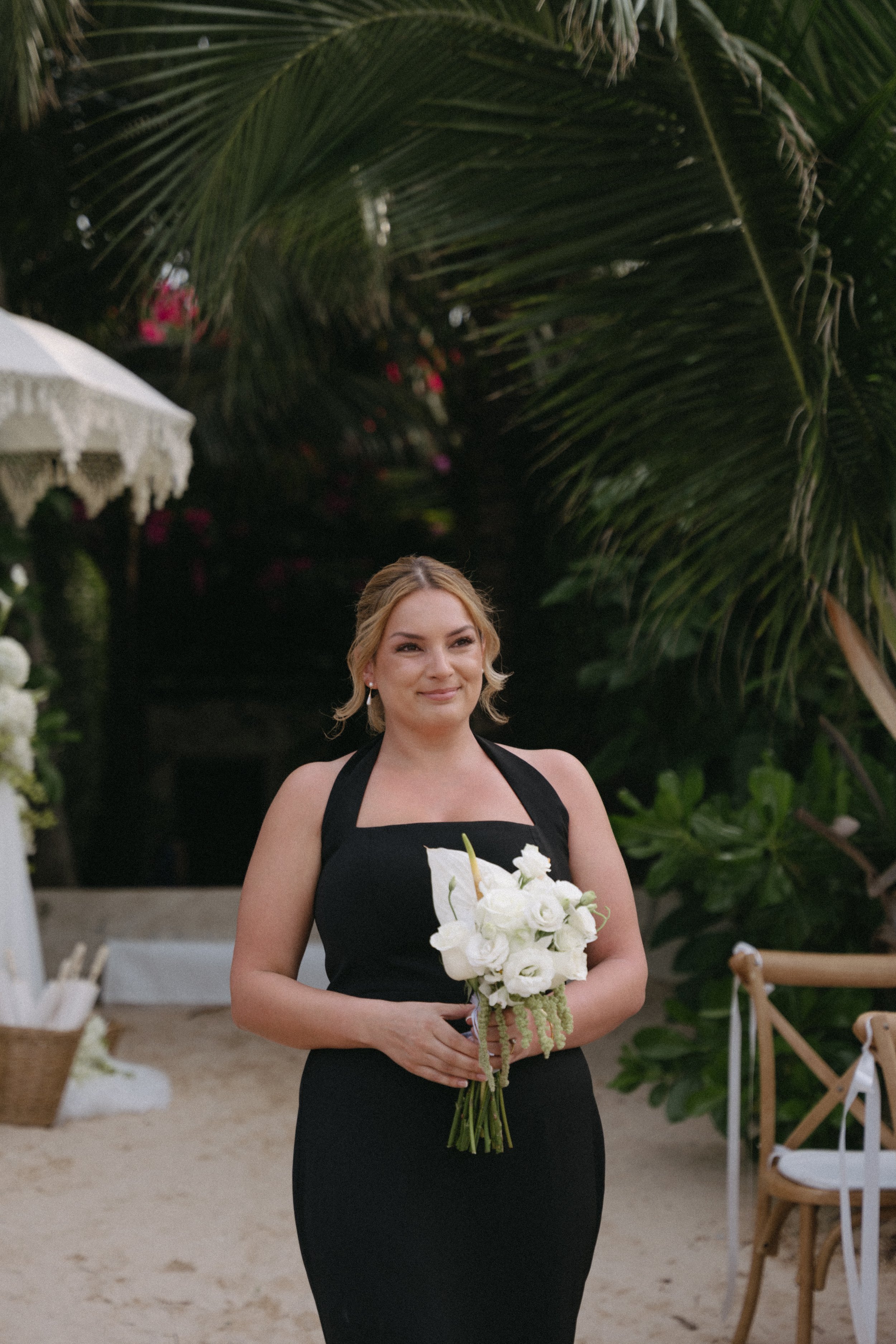 bridesmaid walking down the aisle as the ceremony begins